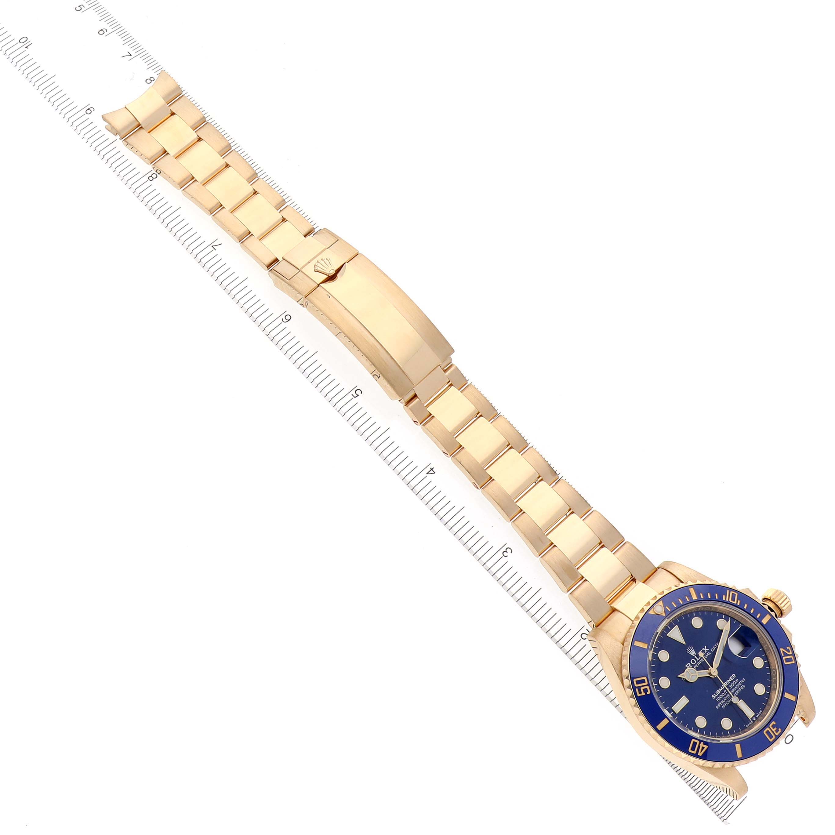 The Rolex Submariner 126618LB Men's Yellow Gold Blue Dial 126618LB Men's Yellow Gold Blue Dial is shown from a top-down angle, displaying the full bracelet and the watch face.