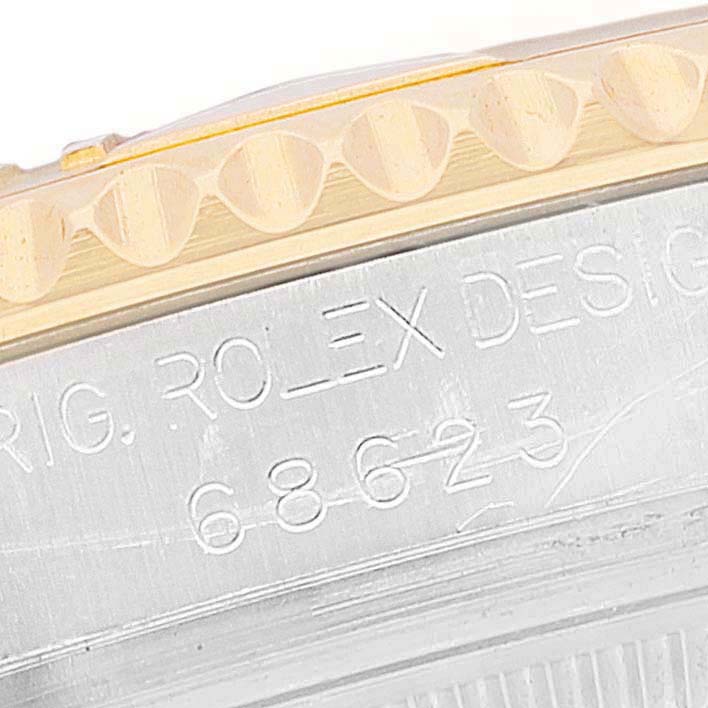 The image shows a close-up of the caseback and bezel of a Rolex Yacht-Master 68623 Men
s Steel and Gold (two tone) White Dial 68623 Men
s Steel and Gold (two tone) White Dial watch, highlighting the model number.