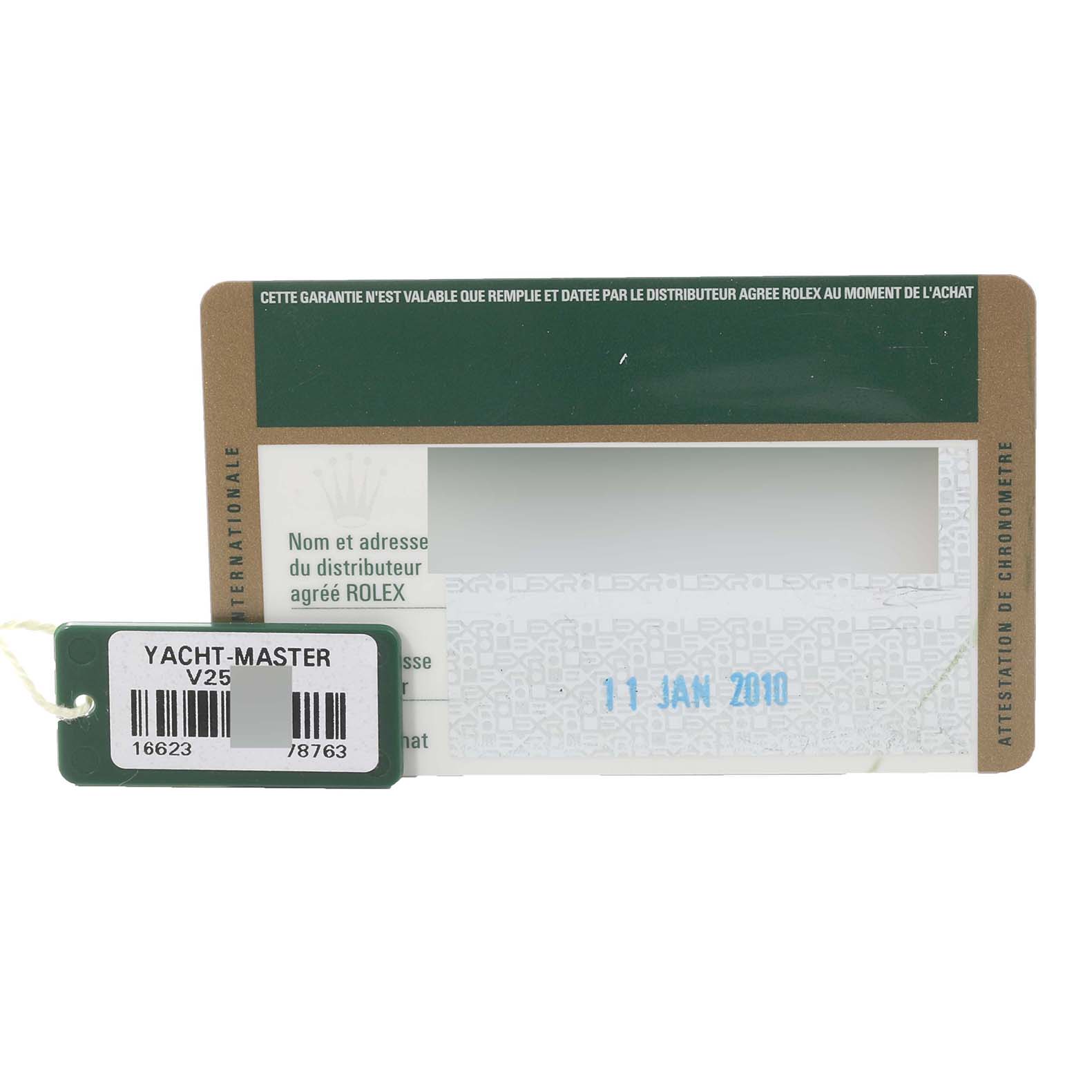 This image shows the warranty card and tag for a Rolex Yacht-Master 16623 Men
s Steel and Gold (two tone) Grey Dial 16623 Men
s Steel and Gold (two tone) Grey Dial watch dated 11 January 2010.