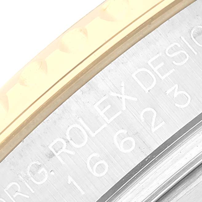 This close-up angle shows the Rolex Yacht-Master 16623 Men
s Steel and Gold (two tone) Grey Dial 16623 Men
s Steel and Gold (two tone) Grey Dial model’s bezel and part of the engraved text on the side of the case.