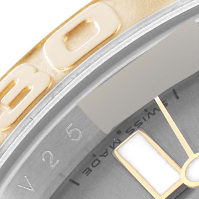 This close-up image of the Rolex Yacht-Master 16623 Men
s Steel and Gold (two tone) Grey Dial 16623 Men
s Steel and Gold (two tone) Grey Dial shows part of the bezel, dial, and hour markers.