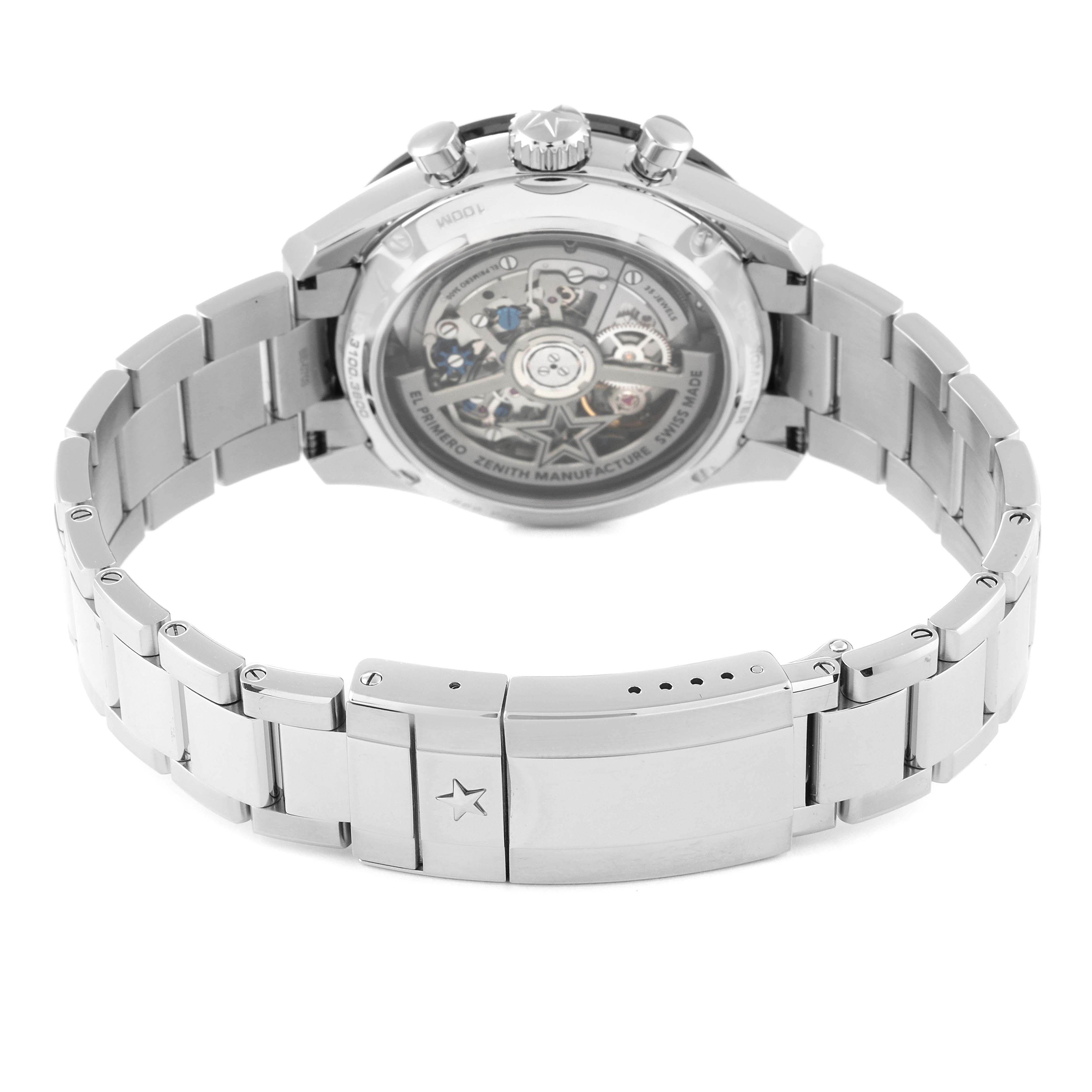 The image shows the back view of a Zenith El Primero watch, highlighting the bracelet and the transparent case back.