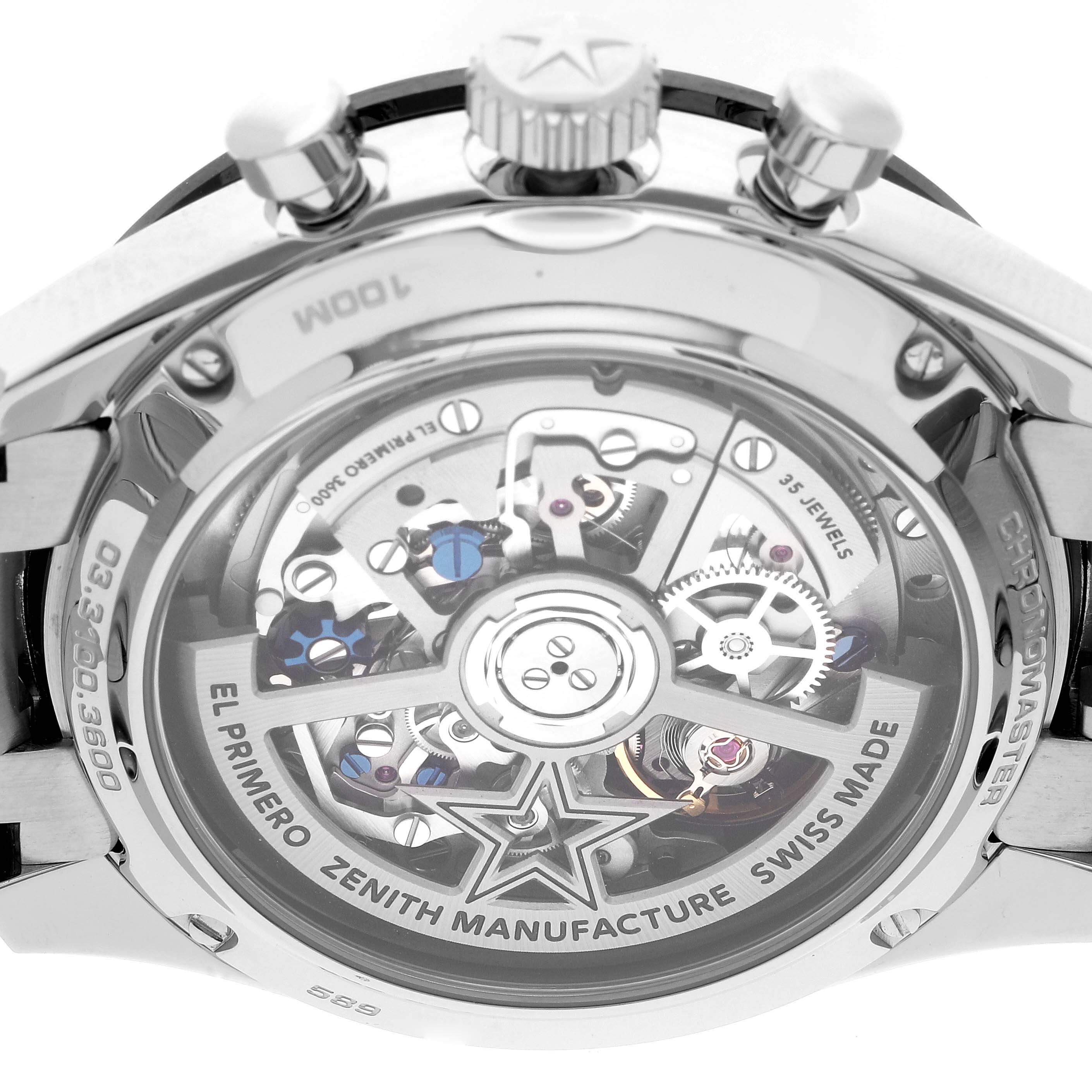 This image shows the back of the Zenith El Primero watch, highlighting its intricate movement and transparent case back.