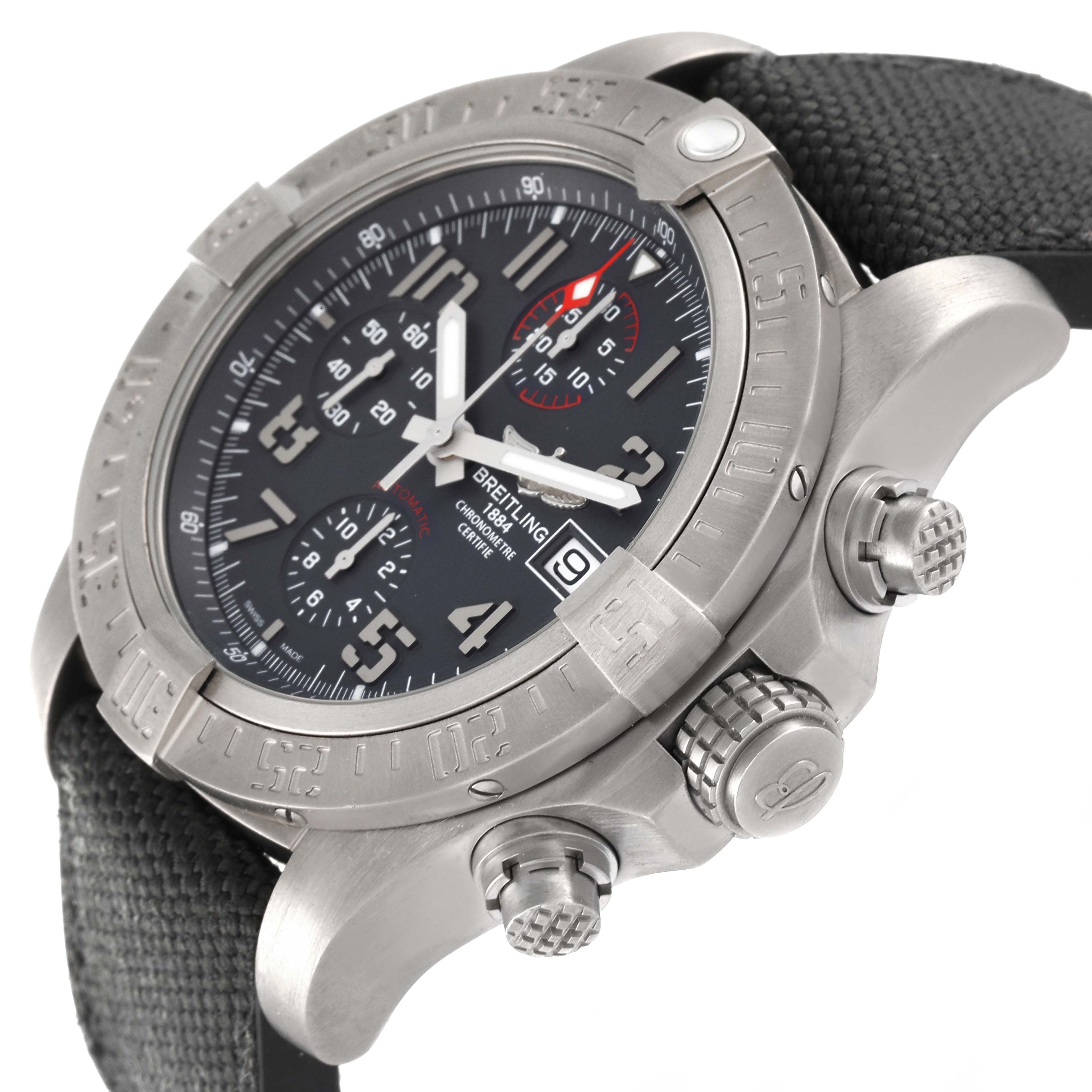 The image shows a side-angle view of the Breitling Avenger E13383 Men's Titanium Grey Dial E13383 Men's Titanium Grey Dial watch, highlighting the bezel, dial, crown, and chronograph pushers.