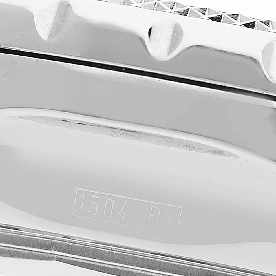 This image shows a close-up of the serial number and part of the bezel of a Bentley model watch by Breitling.