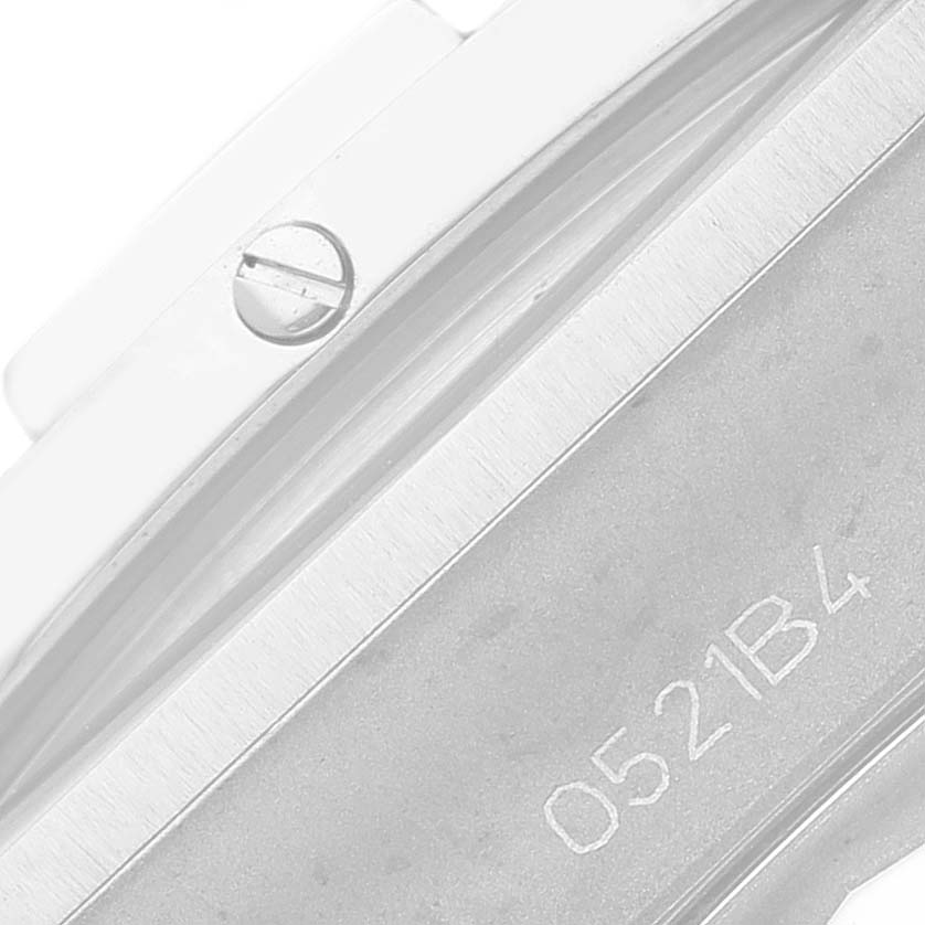 This close-up image shows the side view of a Breitling Chronomat AB0134 Men
s Stainless Steel Green Dial AB0134 Men
s Stainless Steel Green Dial watch, highlighting a portion of the case and a screw.