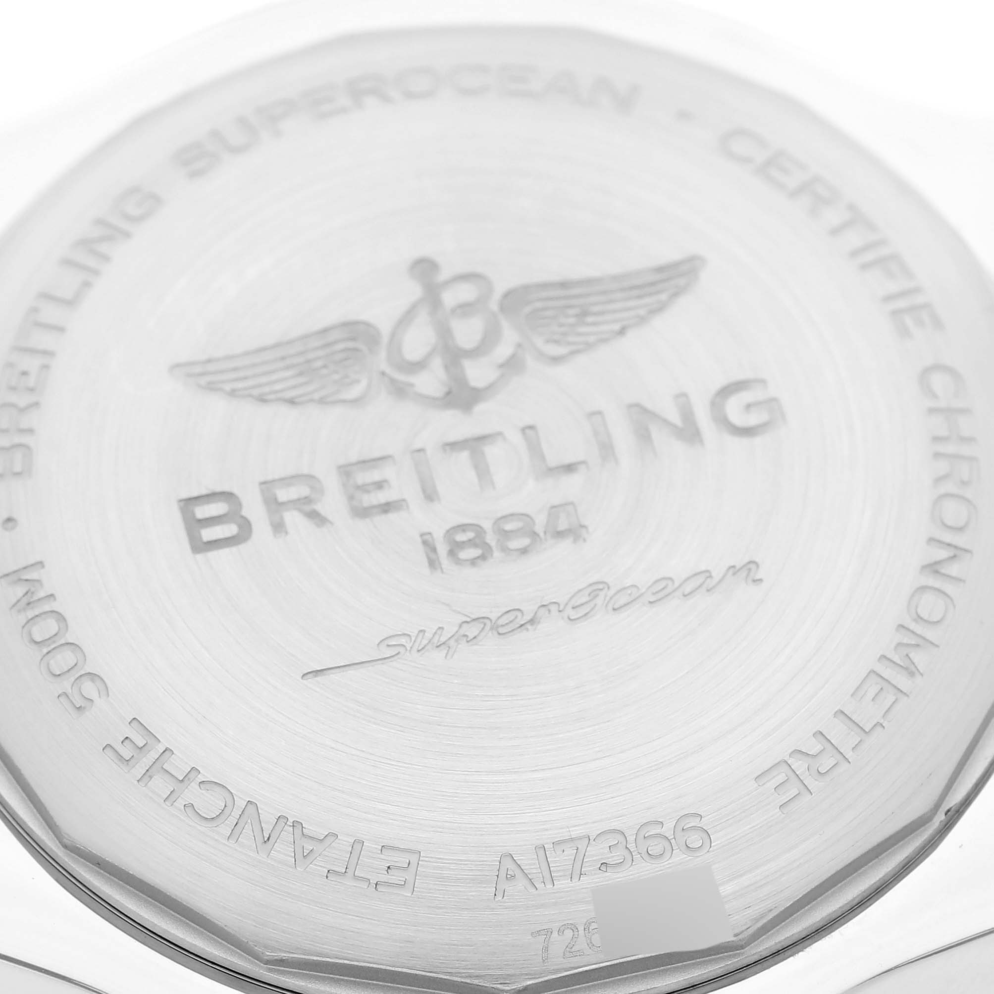 The image shows the case back of the Breitling Superocean A17366 Men's Stainless Steel Orange Dial A17366 Men's Stainless Steel Orange Dial watch, featuring the brand logo, model number, and other engravings.