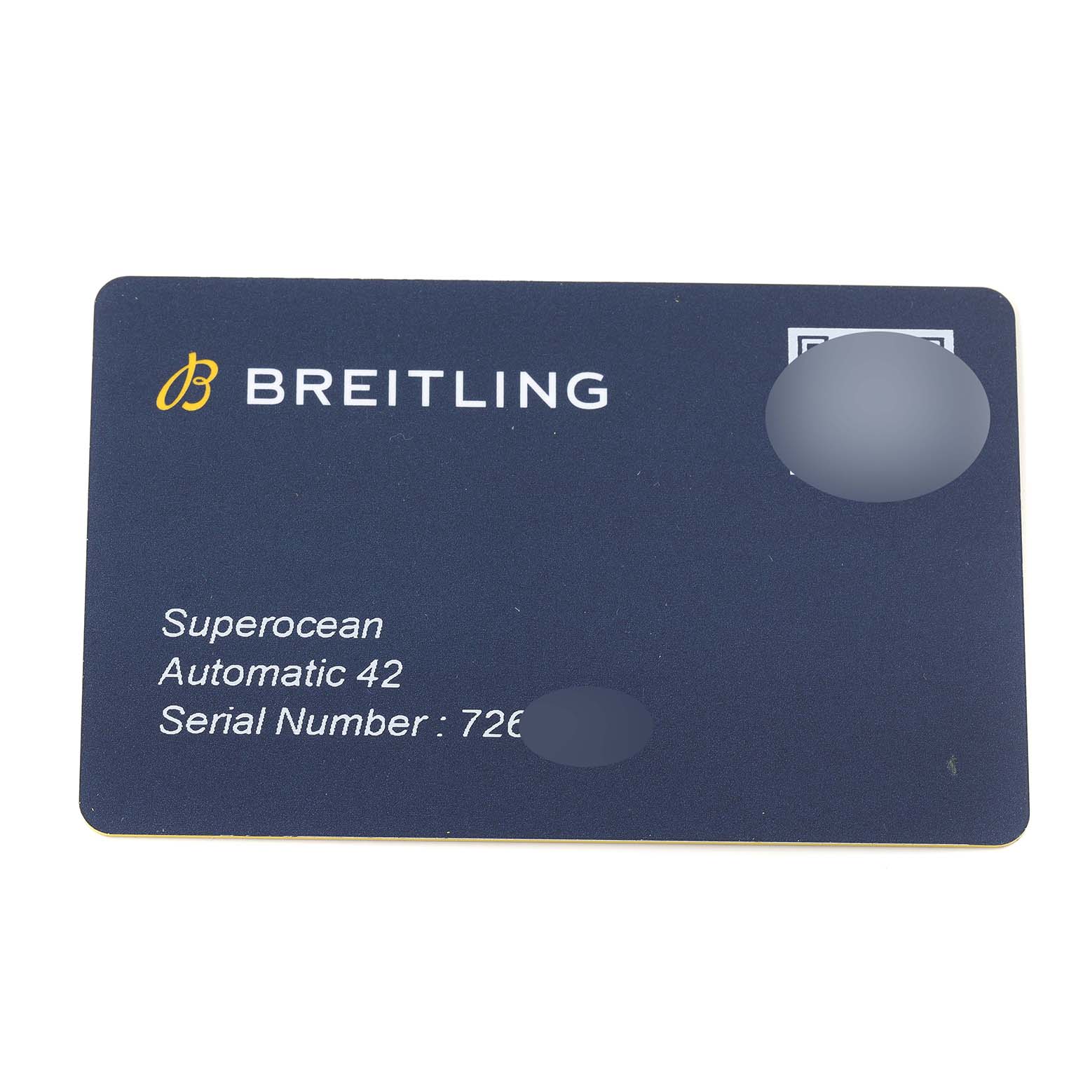 This image shows a Breitling Superocean A17366 Men's Stainless Steel Orange Dial A17366 Men's Stainless Steel Orange Dial Automatic 42 warranty card from a top-down angle.