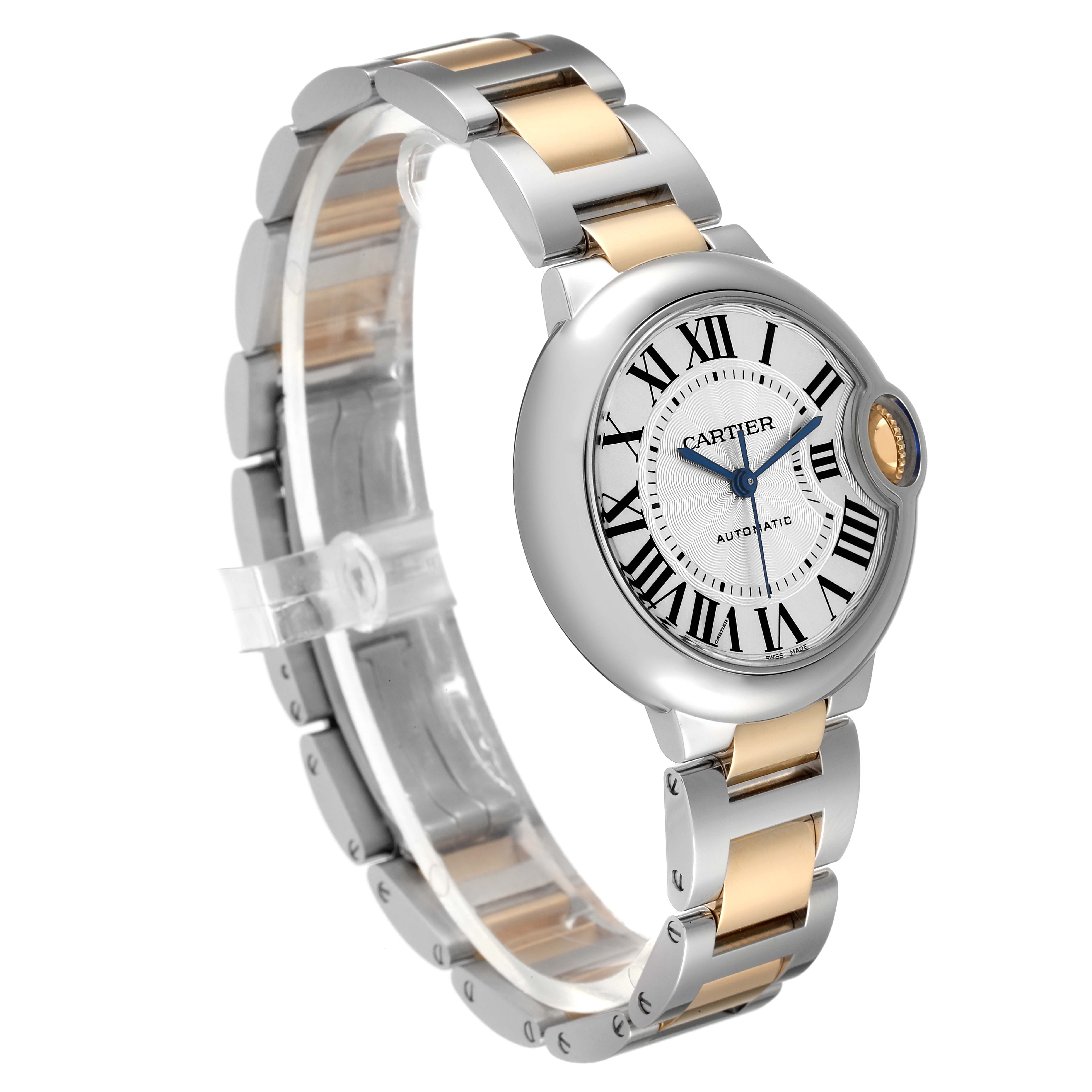 This image shows a Cartier Ballon Bleu W2BB0029 Women
s Steel and Gold (two tone) Silver Dial W2BB0029 Women
s Steel and Gold (two tone) Silver Dial watch at a three-quarter angle, highlighting its dial, bracelet, and crown.