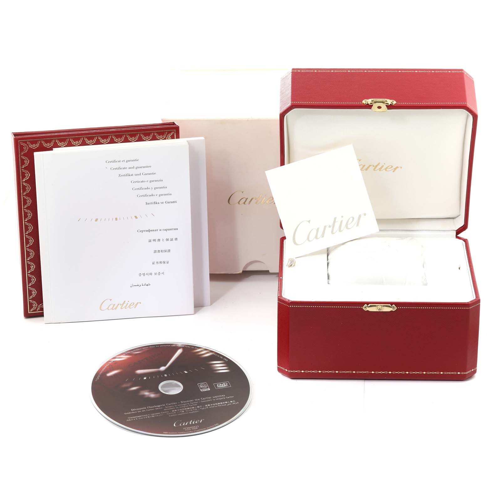 The image shows the accessories of the Cartier Roadster W62017V3 Women's Stainless Steel Pink Dial W62017V3 Women's Stainless Steel Pink Dial watch, including the box, manuals, and a CD.