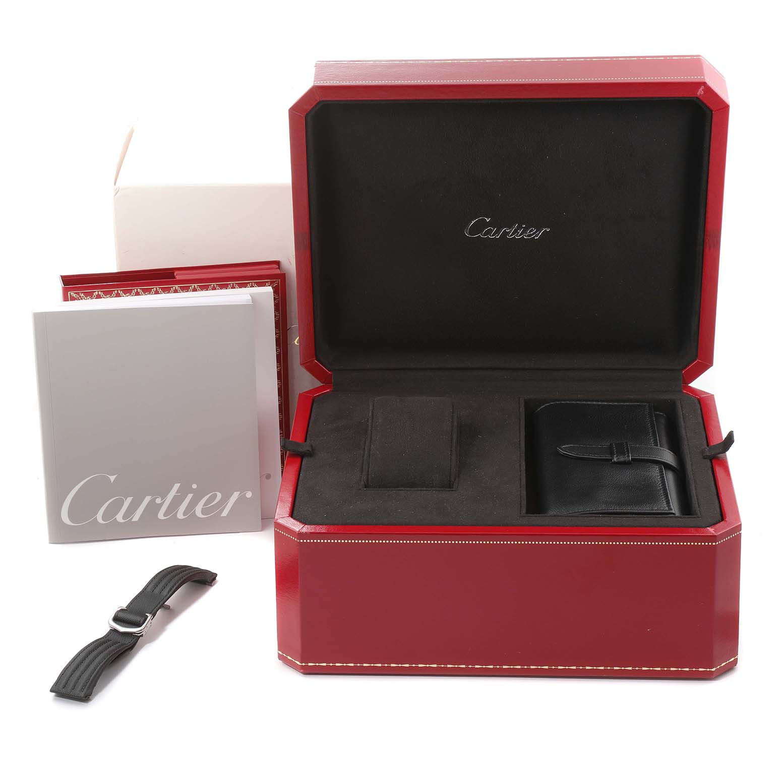 The image shows the Roadster model by Cartier with its red box, additional strap, and accompanying booklets.