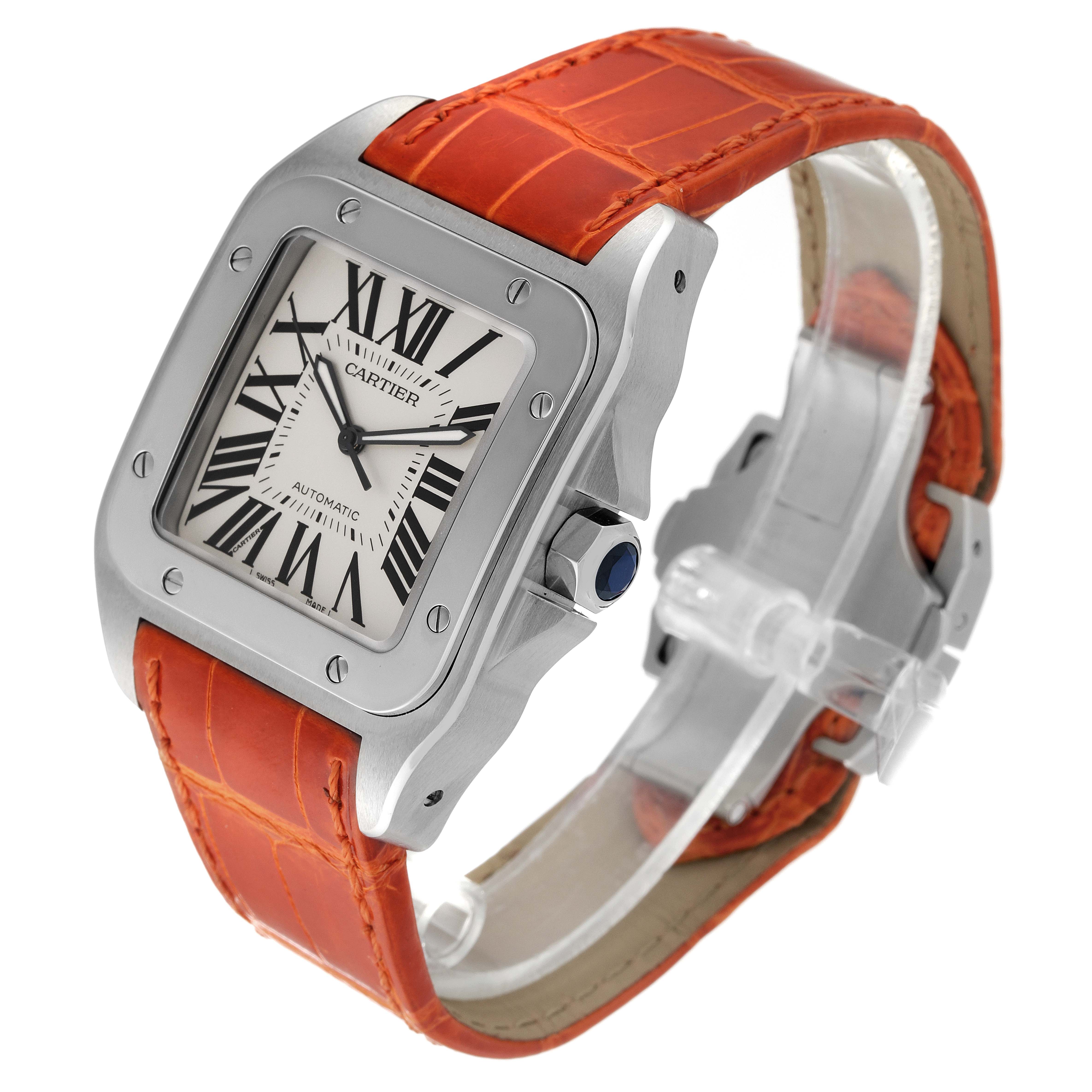The Cartier Santos W20073X8 Men's Stainless Steel Silver Dial W20073X8 Men's Stainless Steel Silver Dial watch is shown at a three-quarter angle, featuring an orange leather strap, square case, and Roman numeral dial.