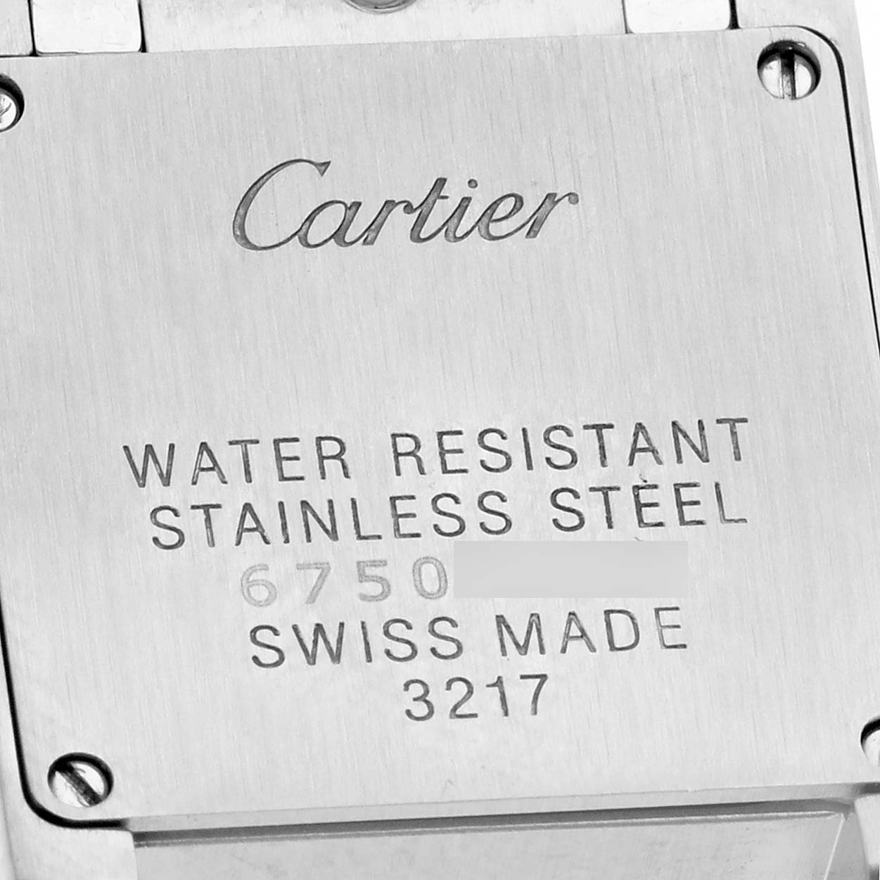 The image shows the back of a Cartier Tank Francaise WE110006 Women's Stainless Steel Silver Dial WE110006 Women's Stainless Steel Silver Dial watch, featuring the engraving details about its materials and water resistance.