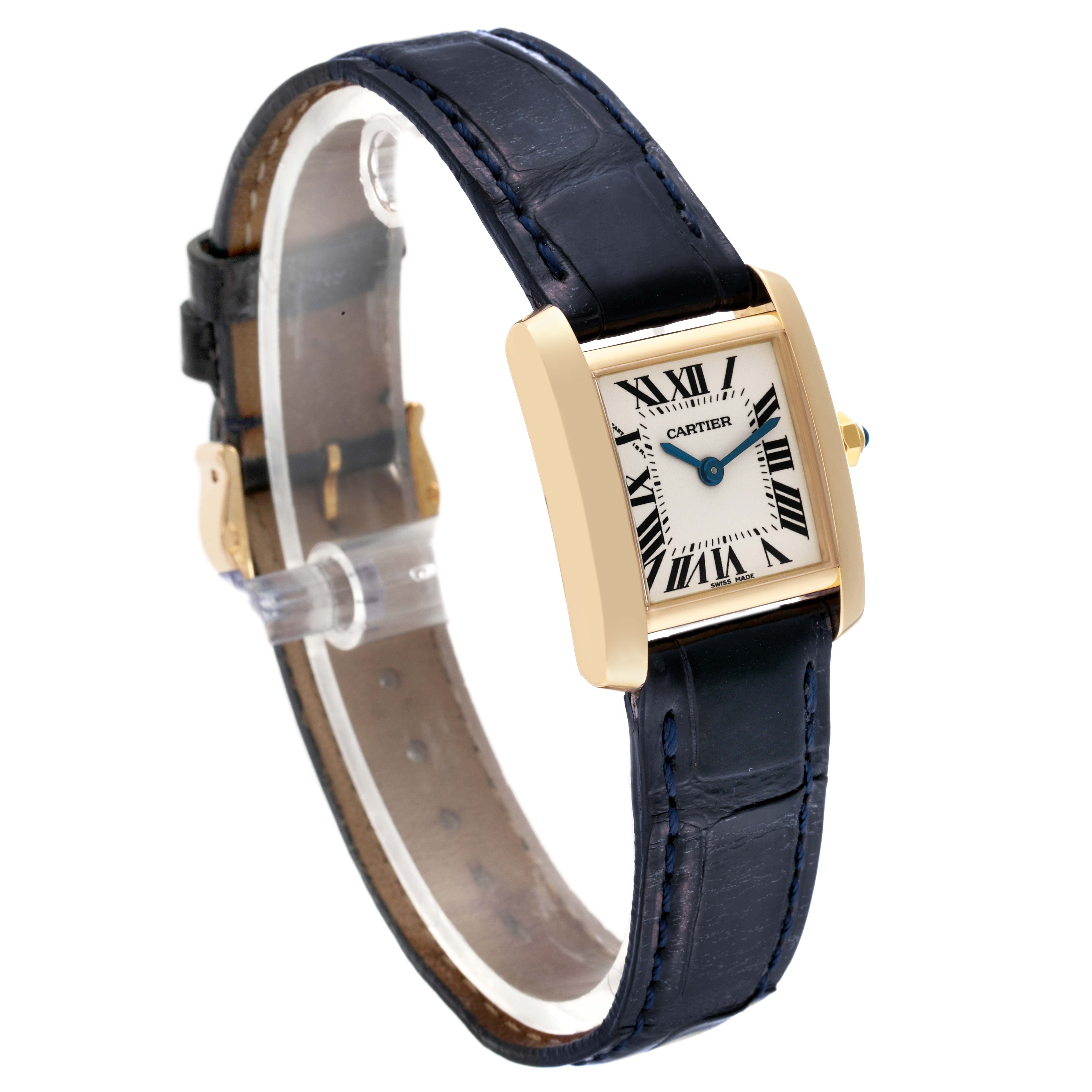 This image shows a Cartier Tank Francaise W5000256 Women
s Yellow Gold Silver Dial W5000256 Women
s Yellow Gold Silver Dial watch at an angled top-down perspective, displaying the dial, case, and leather strap.
