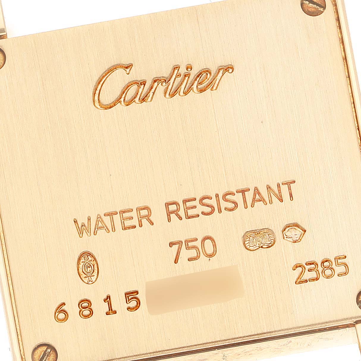The image shows the back case of a Cartier Tank Française watch, highlighting its engravings and water resistance information.