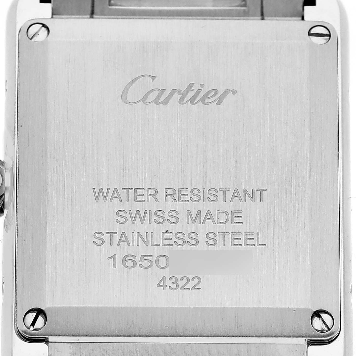 This is the back view of a Cartier Tank Must WSTA0051 Women
s Stainless Steel Silver Dial WSTA0051 Women
s Stainless Steel Silver Dial watch, showing inscriptions on the stainless steel case back.