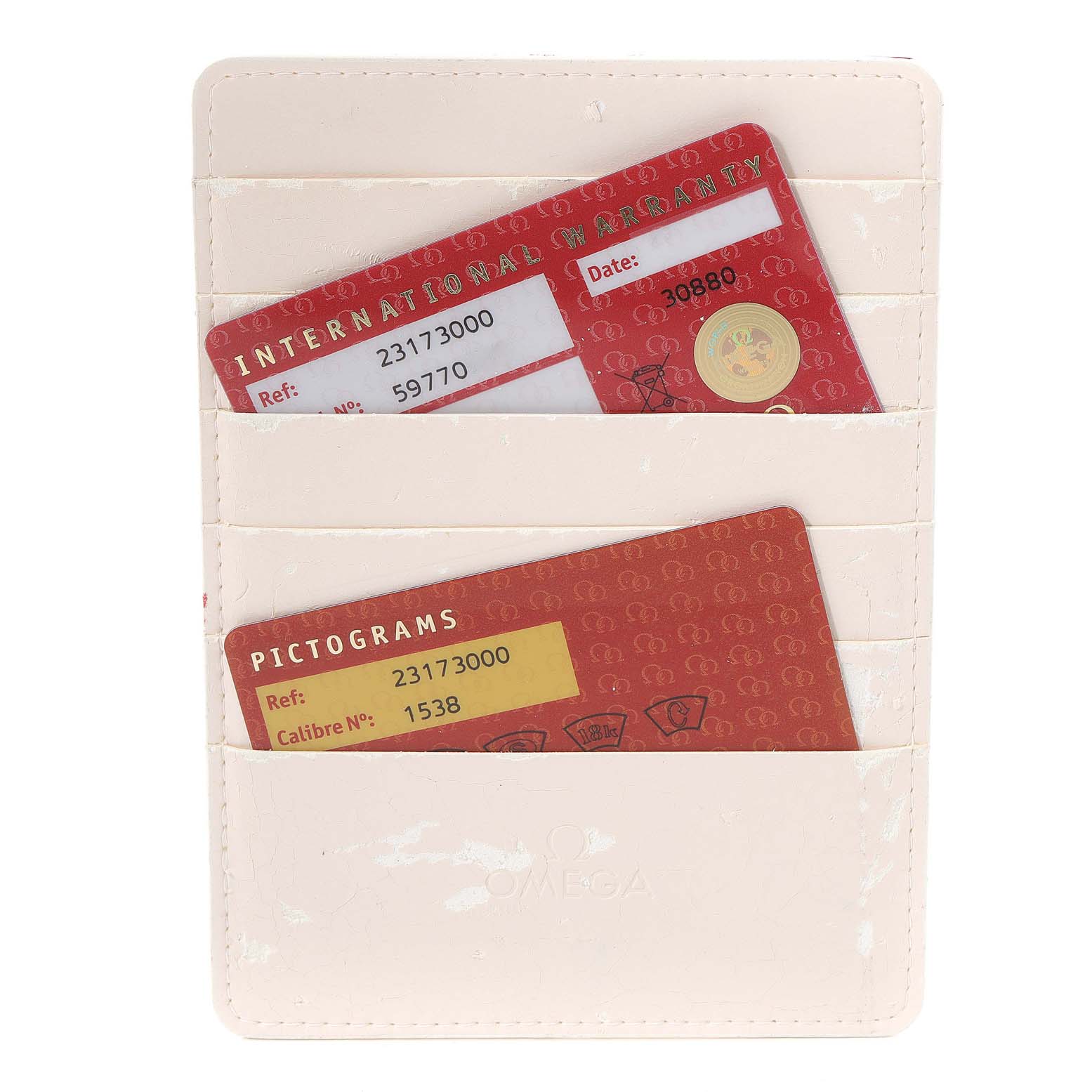 This image shows International Warranty and Pictograms cards for an Omega Aqua Terra 2317.30.00 Men's Steel and Gold (two tone) Silver Dial 2317.30.00 Men's Steel and Gold (two tone) Silver Dial watch in a cream-colored cardholder.