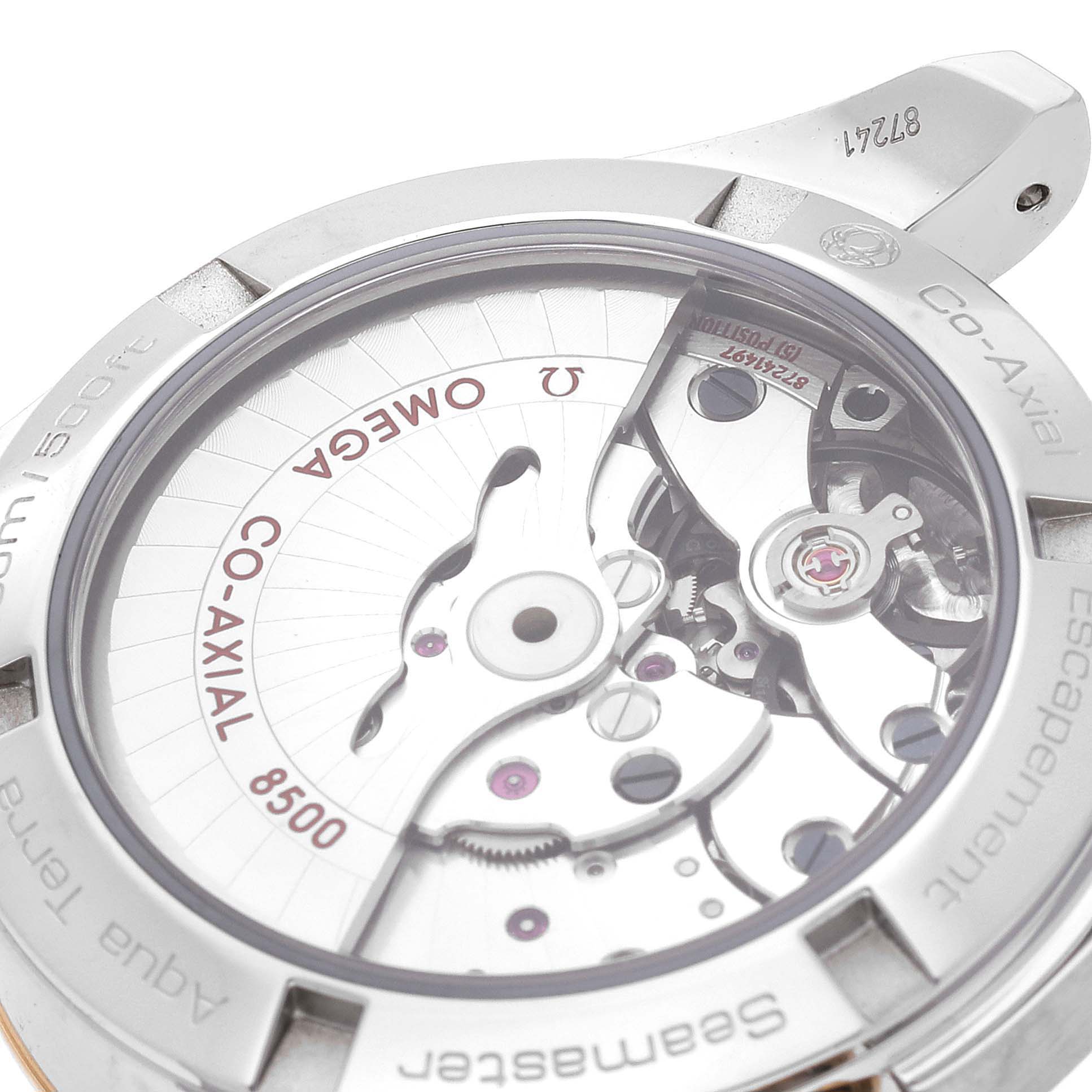 The image shows the Omega Aqua Terra 231.20.39.21.06.004 Men's Stainless Steel Grey Dial 231.20.39.21.06.004 Men's Stainless Steel Grey Dial watch's case back, revealing its Co-Axial 8500 movement mechanism.