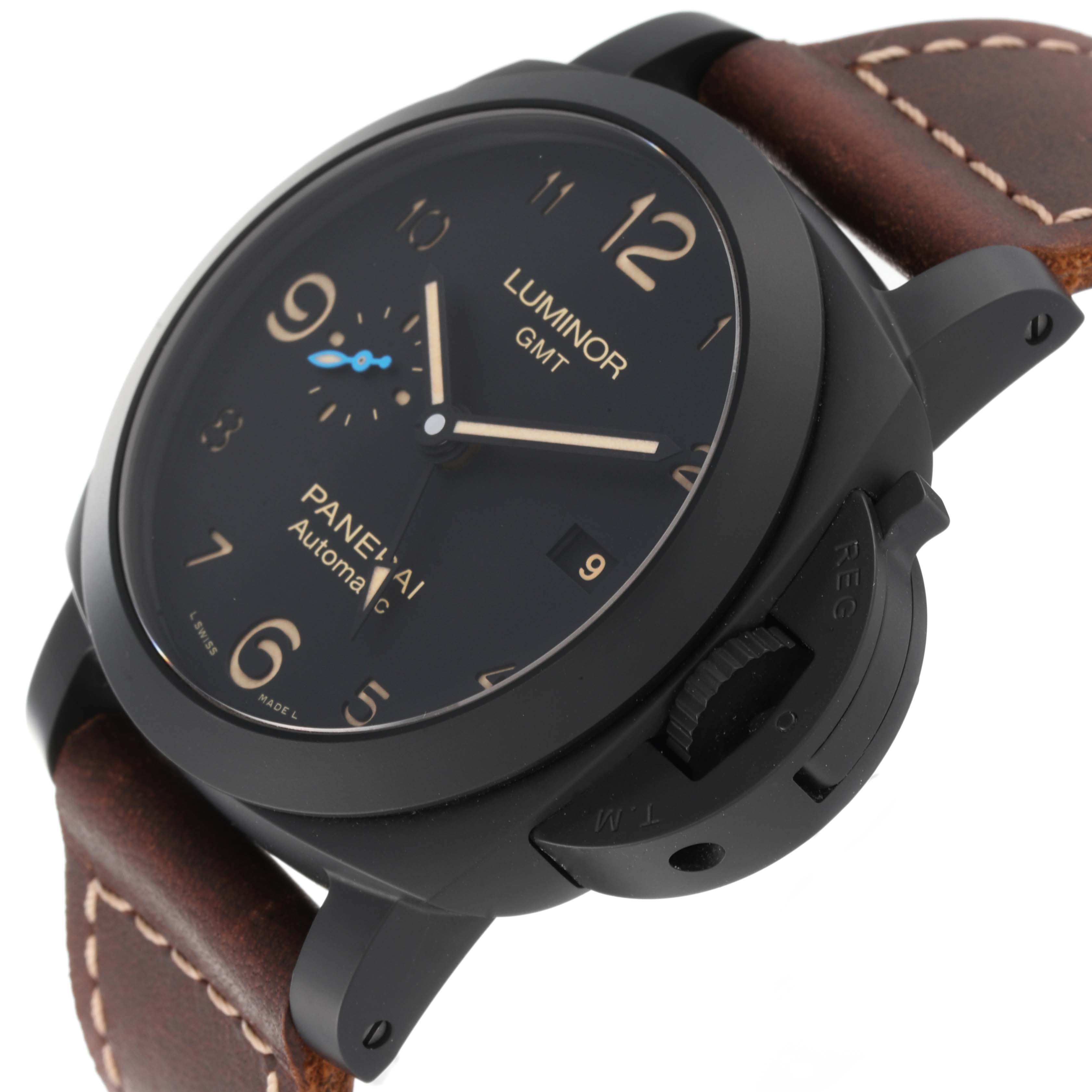 This image shows a Panerai Luminor PAM01441 Men's Ceramic Black Dial PAM01441 Men's Ceramic Black Dial model watch at an angle highlighting its face, bezel, and crown guard, with a brown leather strap.