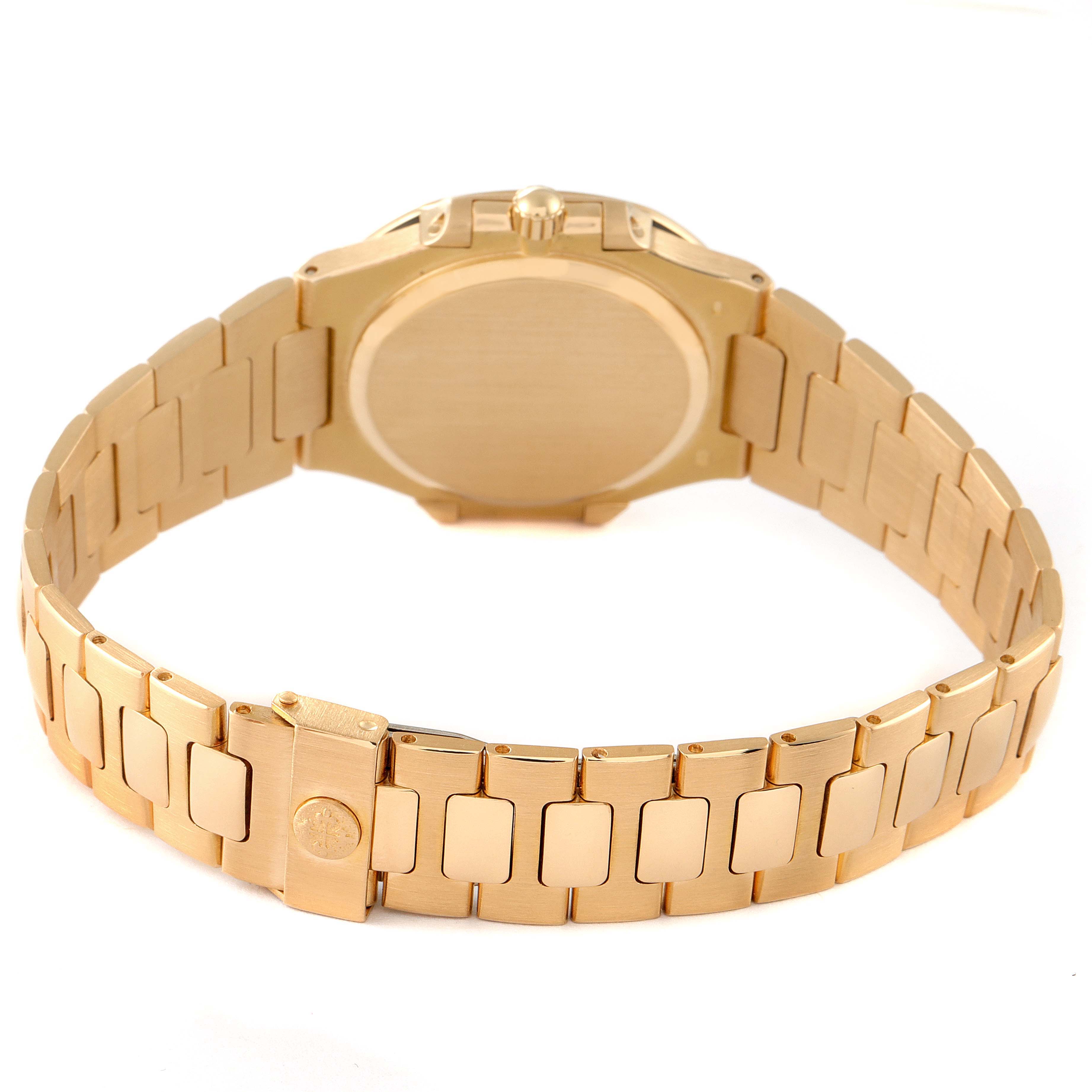 The image shows the back and bracelet of a Patek Philippe Nautilus 3900/003 Women's Yellow Gold Champagne Dial 3900/003 Women's Yellow Gold Champagne Dial watch, highlighting its clasp and link design. 