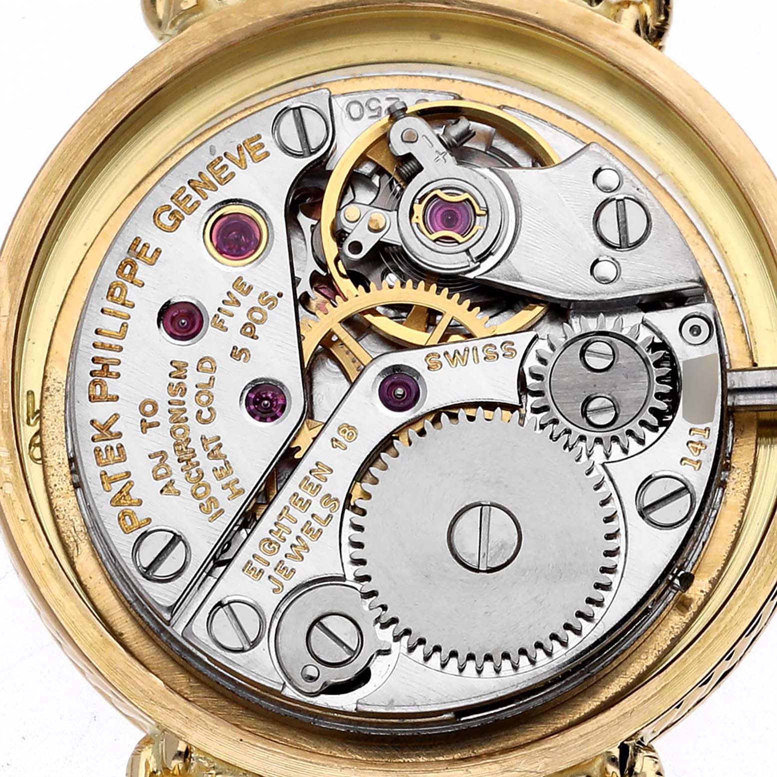 The image shows a close-up of the inner mechanism of a Vintage Patek Philippe watch from the back angle.