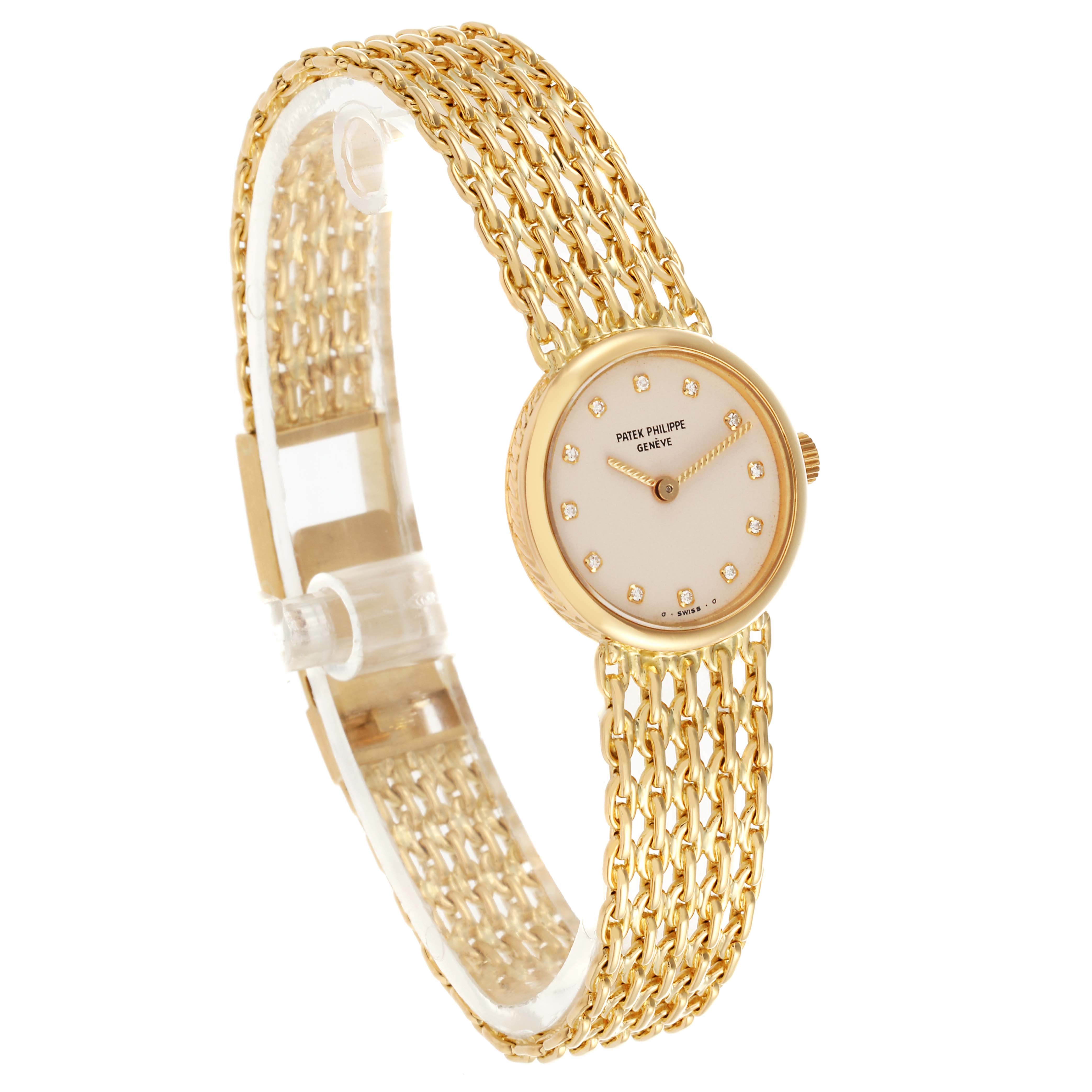 The Patek Philippe Vintage 4647/001 Women's Yellow Gold Beige Dial 4647/001 Women's Yellow Gold Beige Dial watch is shown at a slight angled side view, displaying the face, bracelet, and crown.