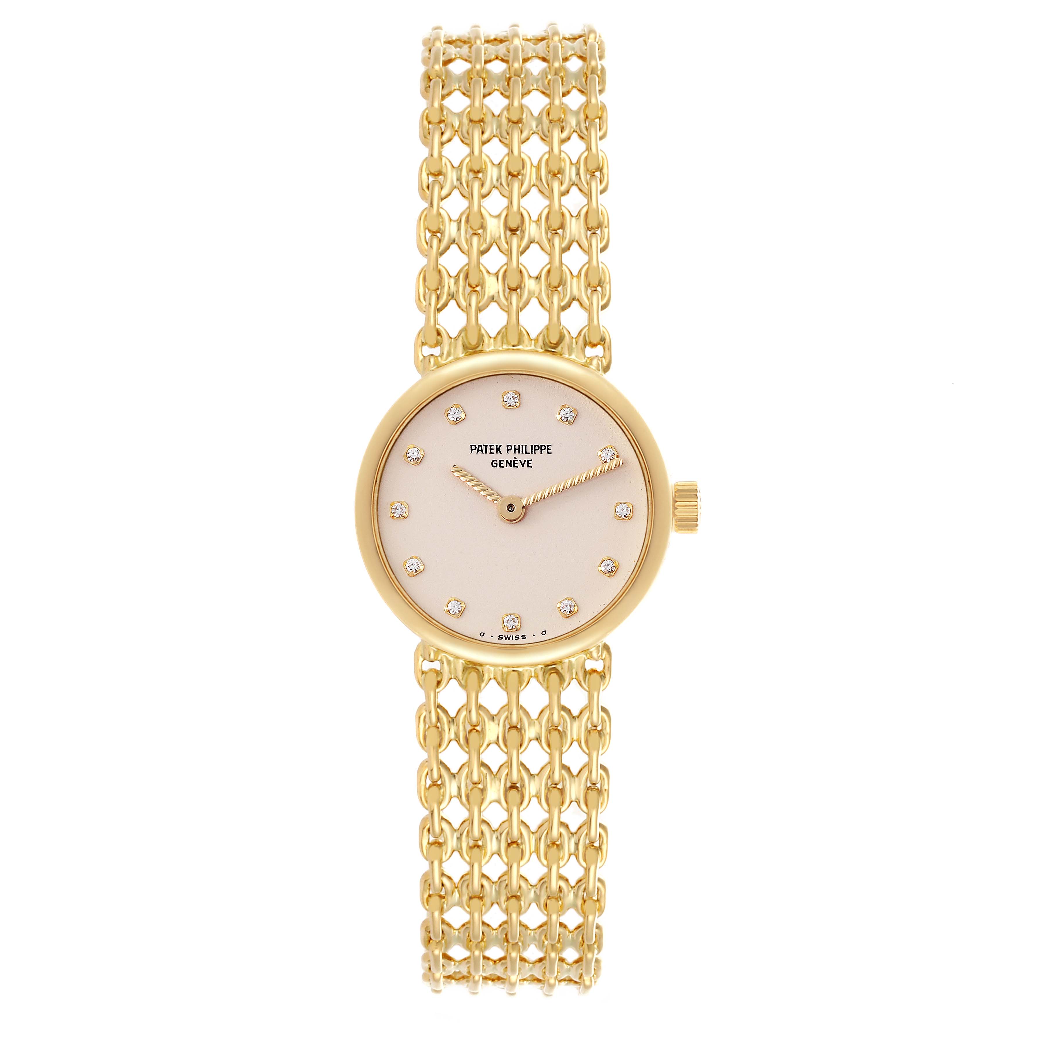 The Patek Philippe Vintage 4647/001 Women's Yellow Gold Beige Dial 4647/001 Women's Yellow Gold Beige Dial model is shown from a top view, displaying its round face and intricate gold bracelet.
