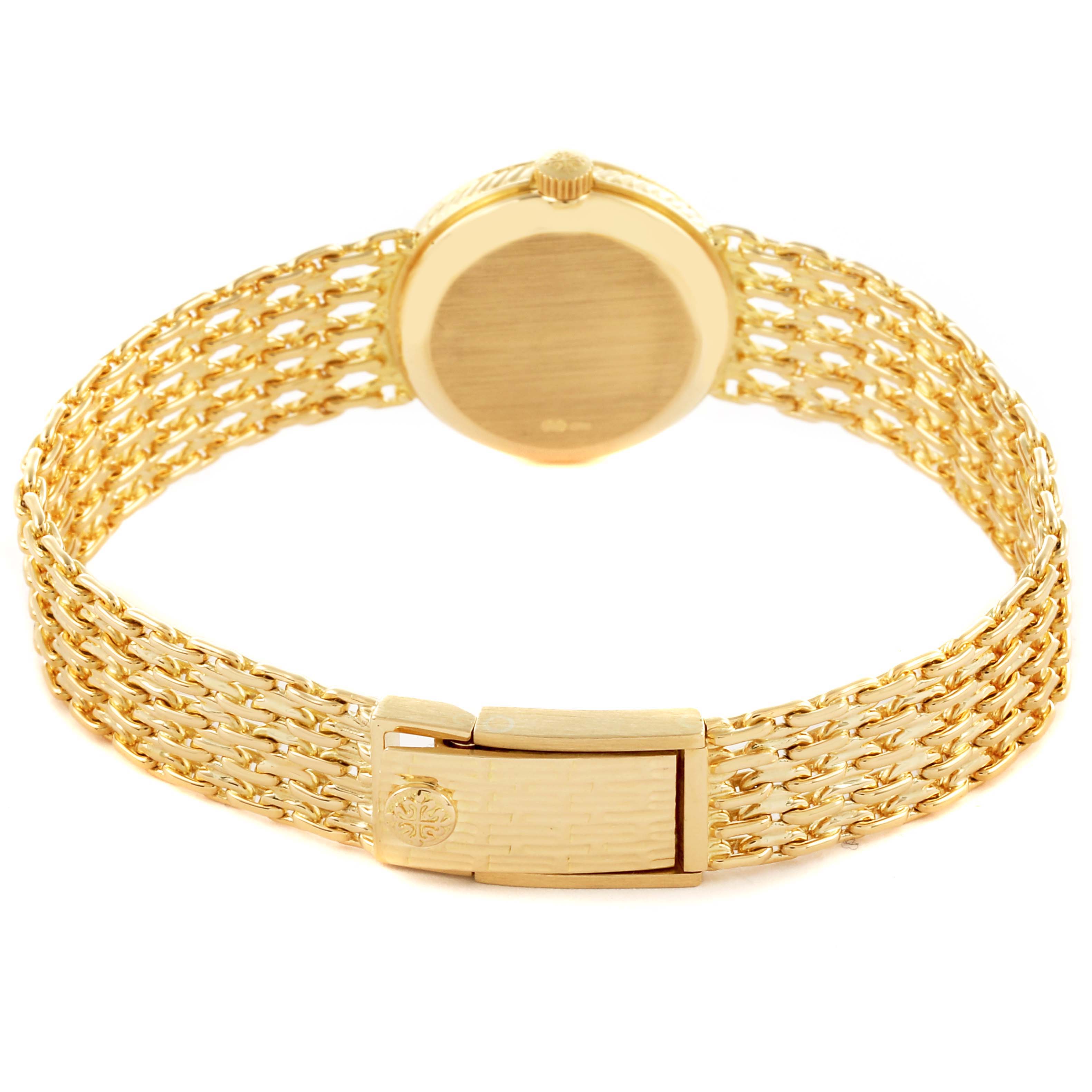 The Vintage Patek Philippe watch is shown from the back, highlighting its gold bracelet and clasp.
