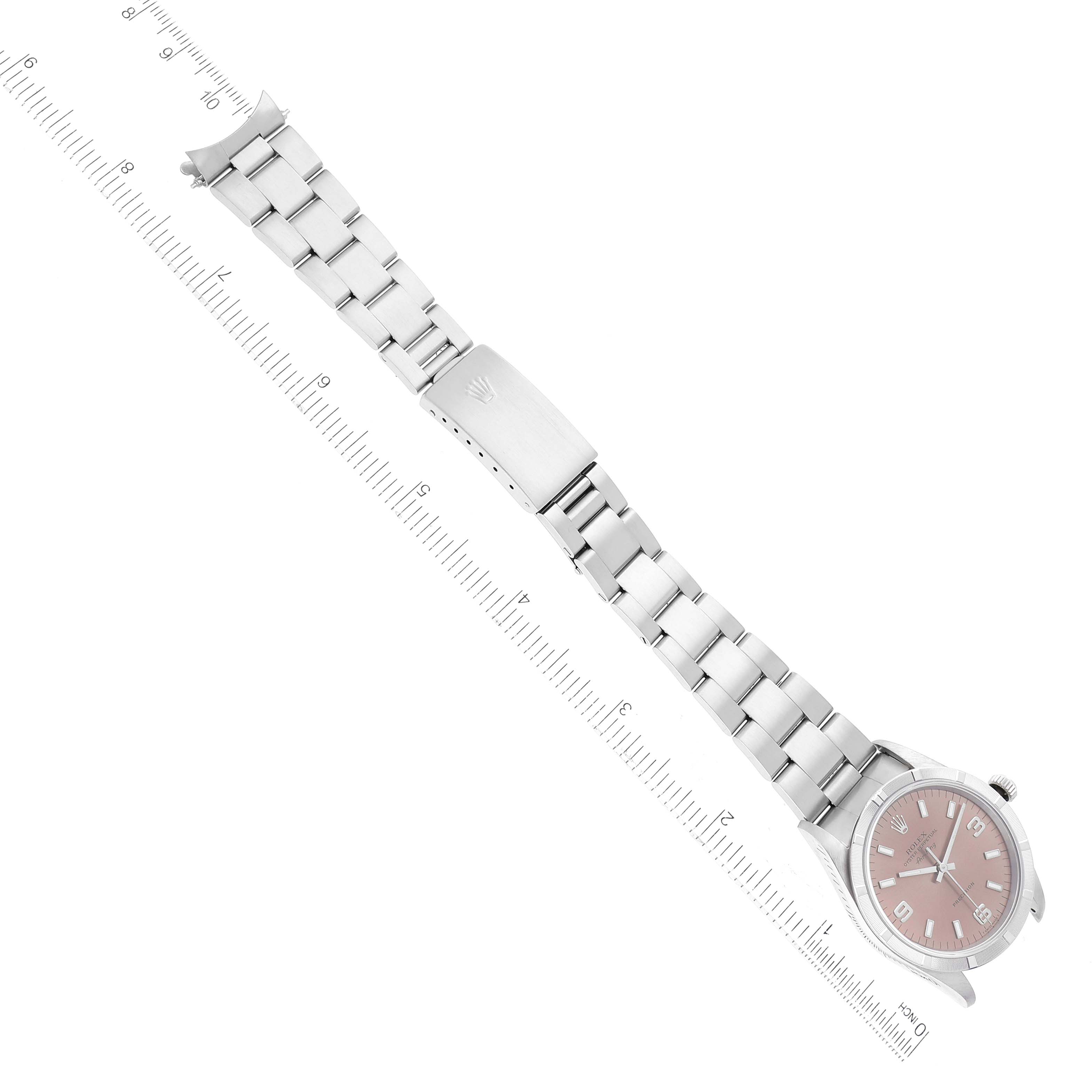 The image shows a Rolex Air-King 14010 Men's Stainless Steel Pink Dial 14010 Men's Stainless Steel Pink Dial watch from a top-down angle, featuring its face, bracelet, and clasp next to a ruler for scale.