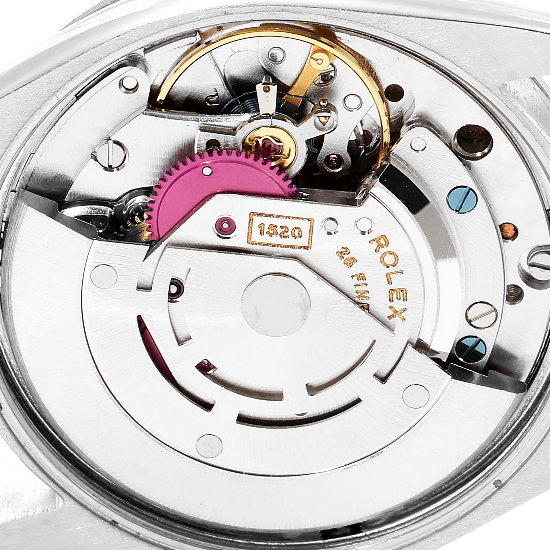 The image shows the intricate internal mechanics of a Vintage Collection Rolex watch, captured at a close-up angle.