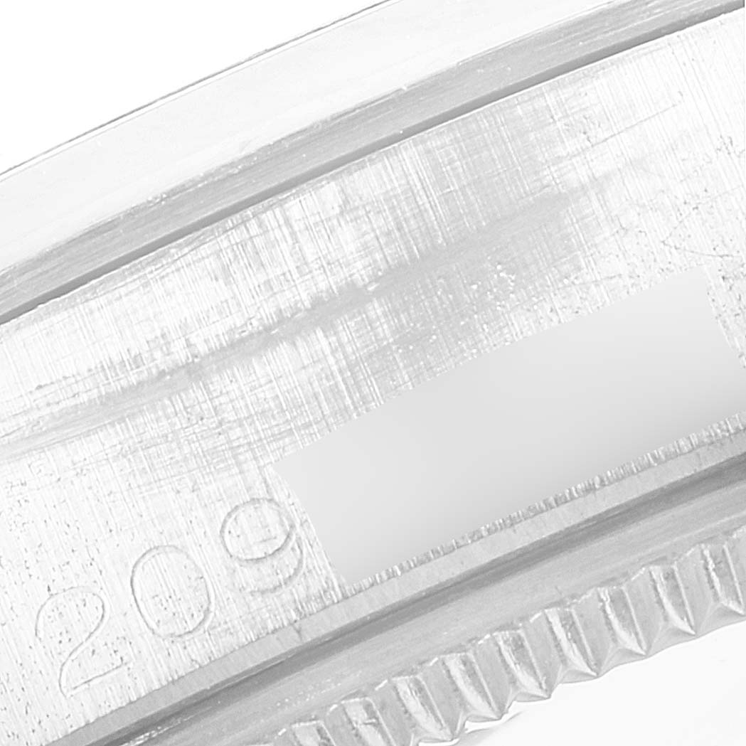 This close-up image of a Rolex Vintage Collection 5500 Men
s Stainless Steel Silver Dial 5500 Men
s Stainless Steel Silver Dial model shows the serial number area and part of the bezel.