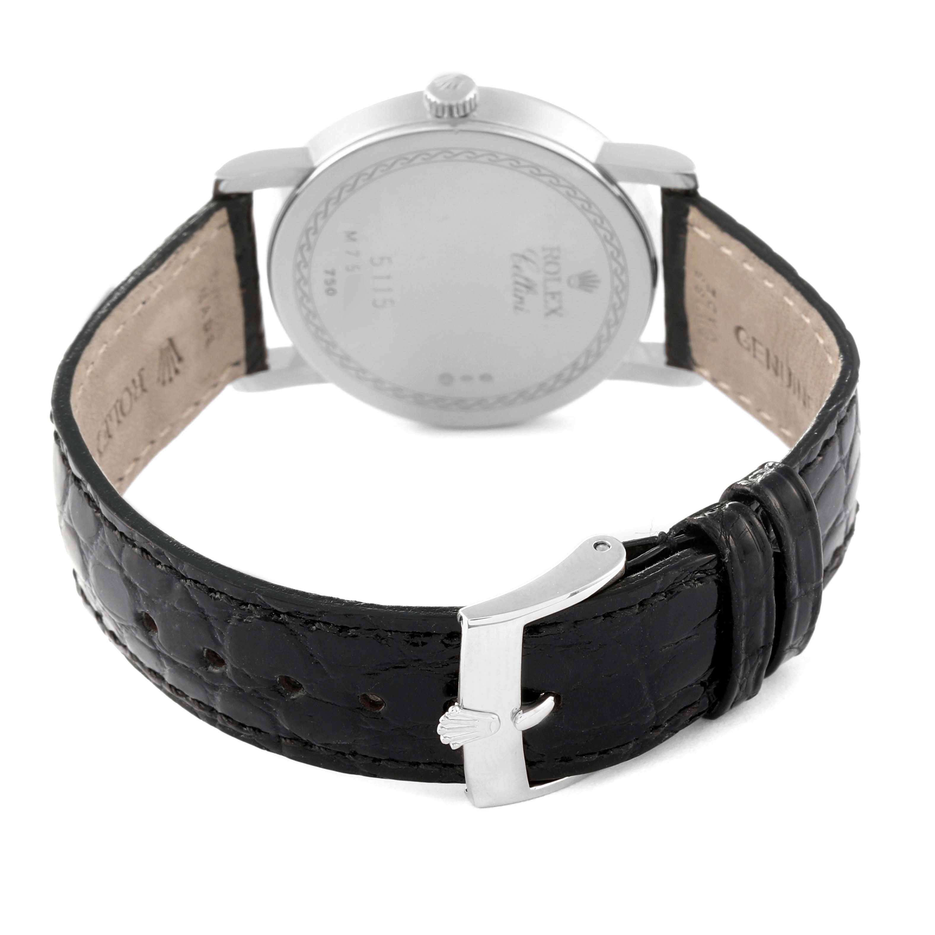 The image shows the back view of a Rolex Cellini 5115/9 Men
s White Gold Silver Dial 5115/9 Men
s White Gold Silver Dial watch with its black leather strap and buckle.