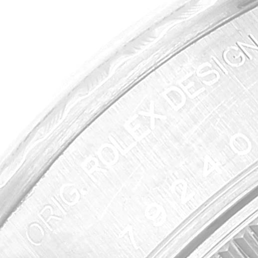 This close-up image shows part of the case back edge and engravings of the Date model by Rolex.
