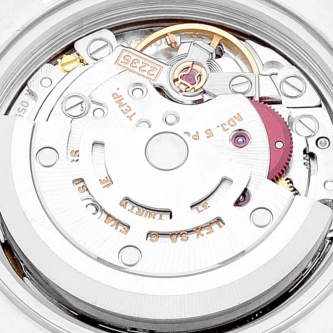 This image shows a close-up view of the movement mechanism of a Rolex Date 79240 Women's Stainless Steel Blue Dial 79240 Women's Stainless Steel Blue Dial model watch.
