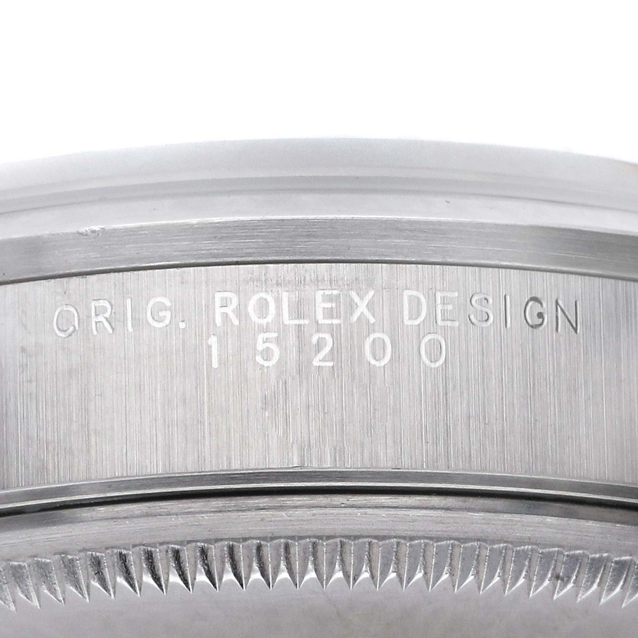 The image shows the side of a Rolex Date 15200 Men's Stainless Steel Blue Dial 15200 Men's Stainless Steel Blue Dial model with engravings indicating "ORIG. ROLEX DESIGN 15200."