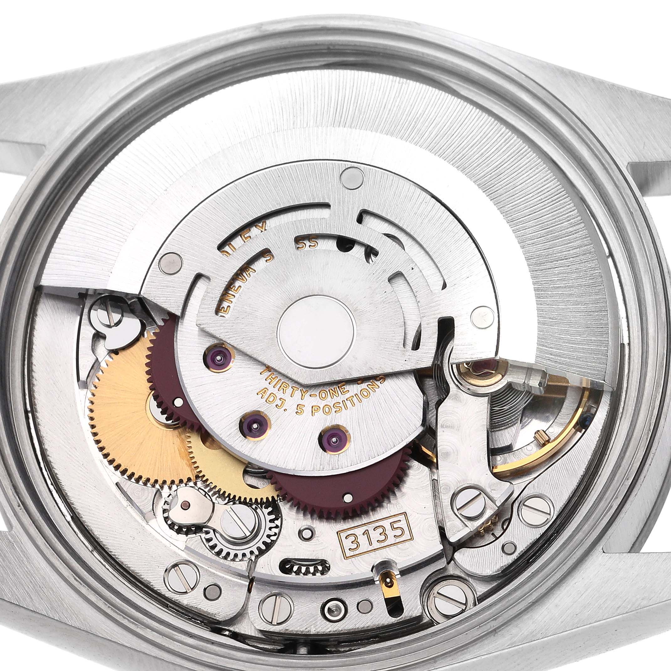The image shows the internal movement of a Rolex Date 15200 Men's Stainless Steel Blue Dial 15200 Men's Stainless Steel Blue Dial watch from a top-down angle, revealing gears and the rotor.