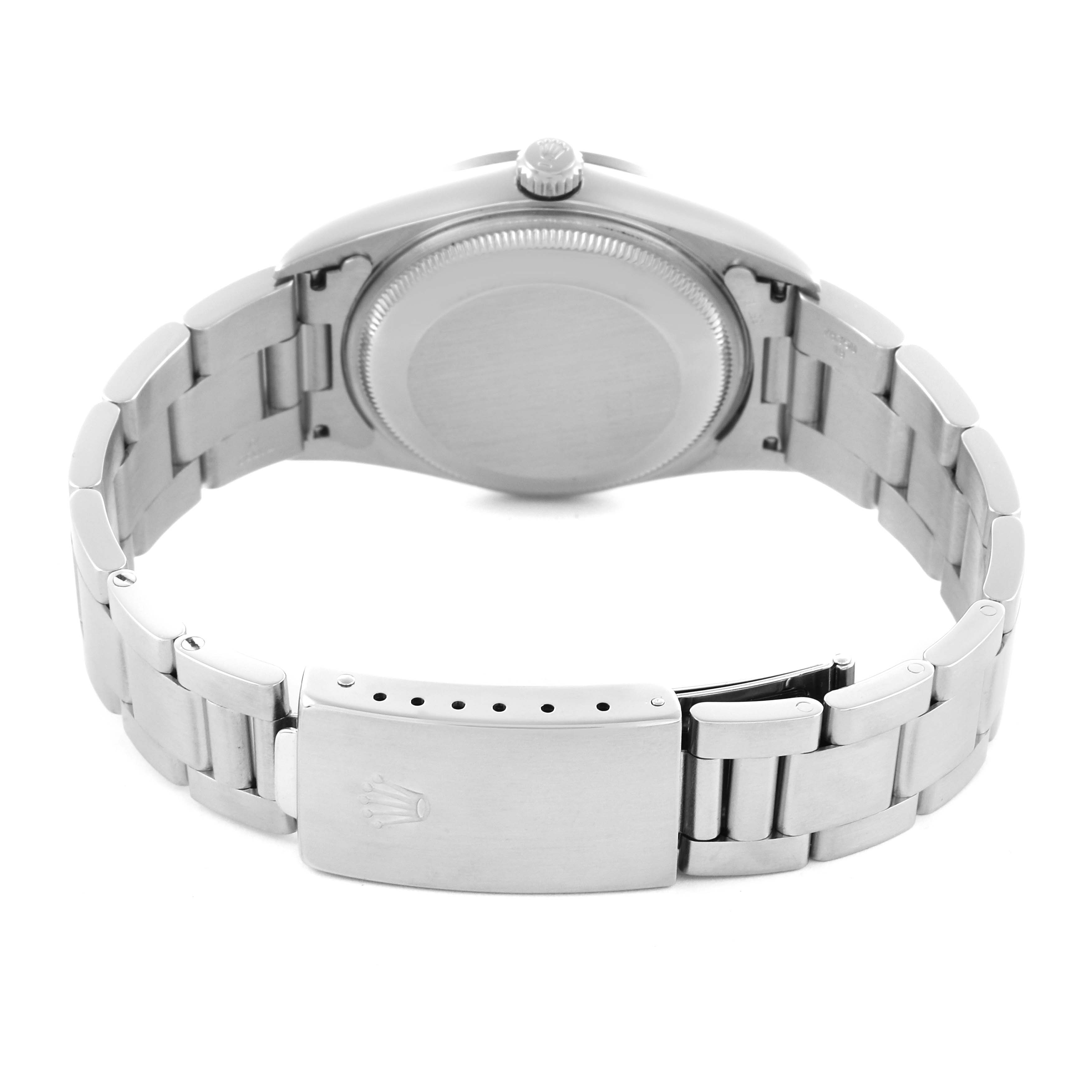 The Rolex Date 15200 Men's Stainless Steel Blue Dial 15200 Men's Stainless Steel Blue Dial watch is shown from the back, displaying its closed clasp and stainless steel bracelet.