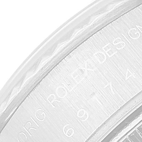 This close-up image shows the engraved bezel of a Rolex Datejust 69174 Women's Stainless Steel Pink Dial 69174 Women's Stainless Steel Pink Dial watch.