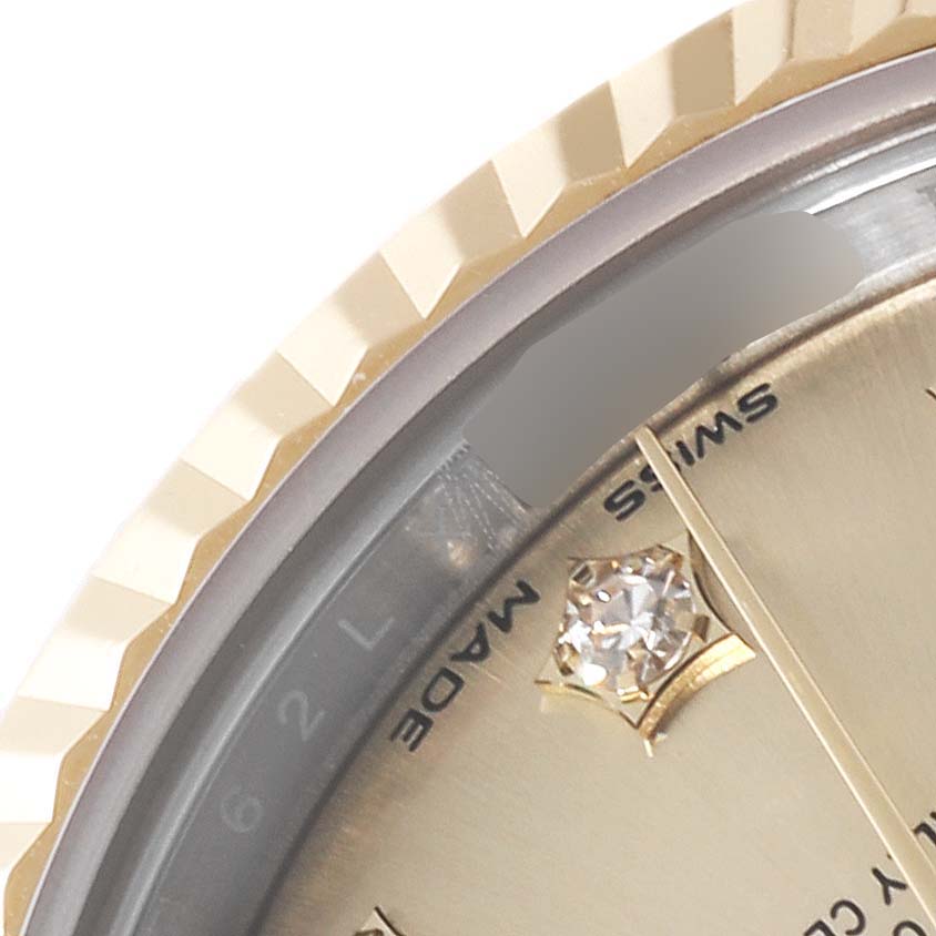 The close-up angle shows the bezel, part of the dial, and a diamond hour marker of the Rolex Datejust 279173 Women's Steel and Gold (two tone) Champagne Dial 279173 Women's Steel and Gold (two tone) Champagne Dial watch.
