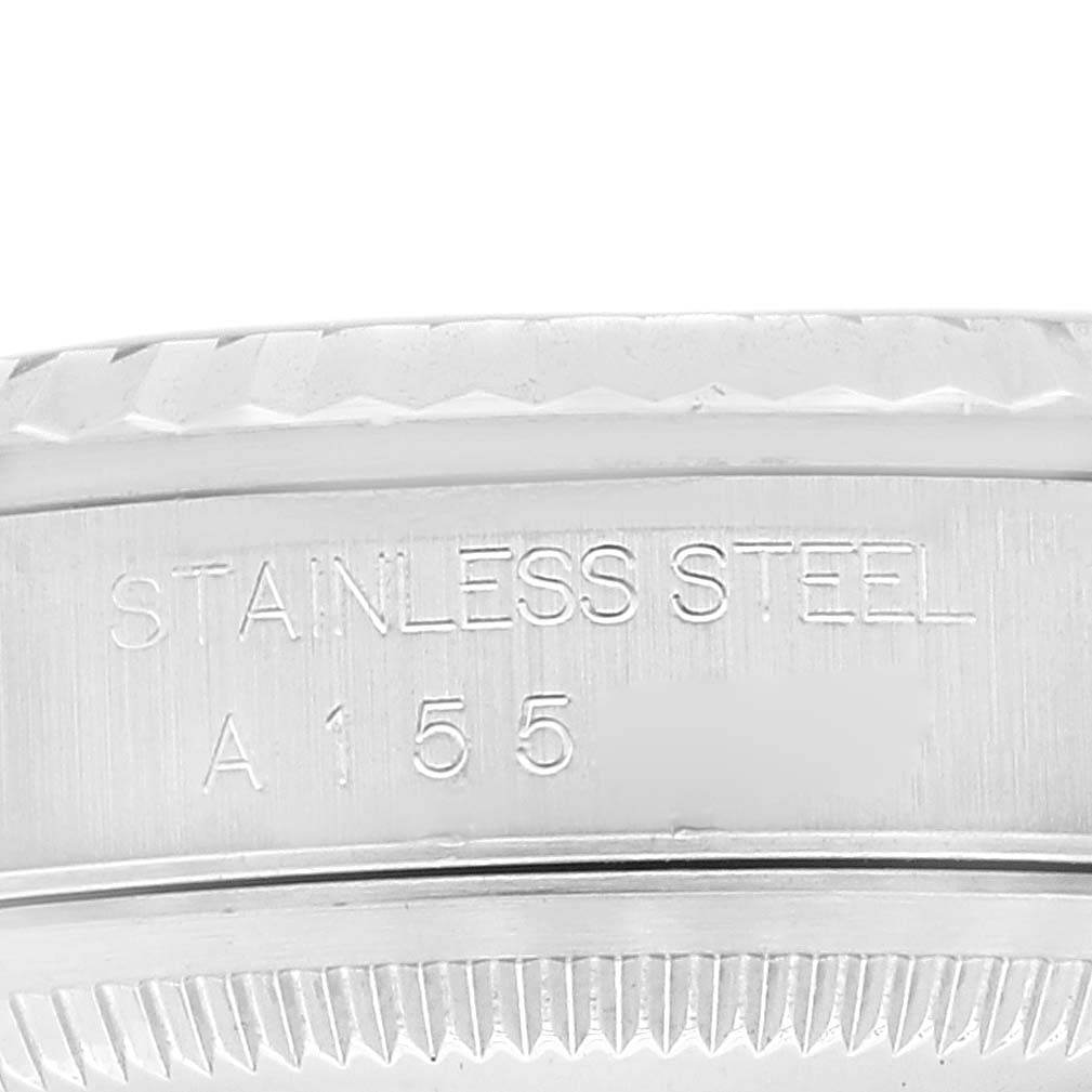 This image shows a close-up view of the side of the stainless steel case back on a Rolex Datejust 16234 Men's Stainless Steel Blue Dial 16234 Men's Stainless Steel Blue Dial watch.