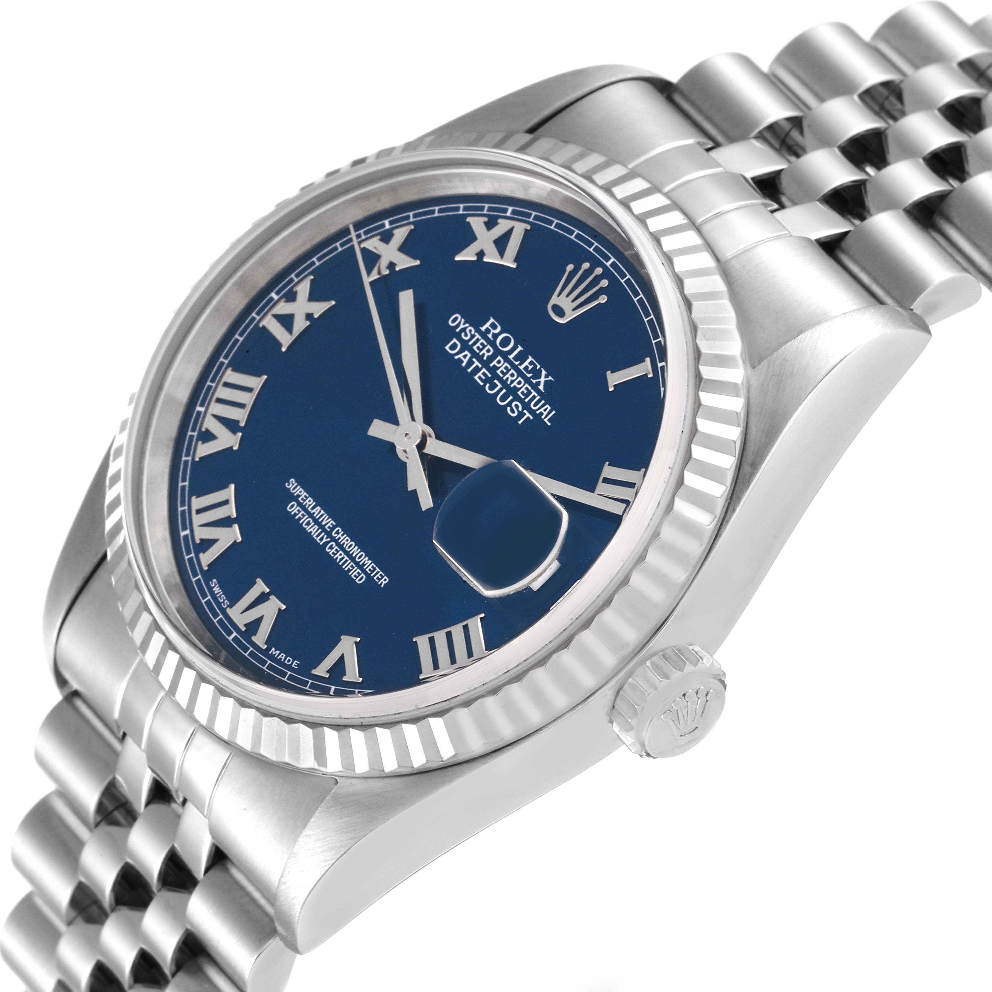 This image shows a Rolex Datejust 16234 Men's Stainless Steel Blue Dial 16234 Men's Stainless Steel Blue Dial watch at an angle displaying its blue dial, Roman numerals, fluted bezel, and part of its Jubilee bracelet.