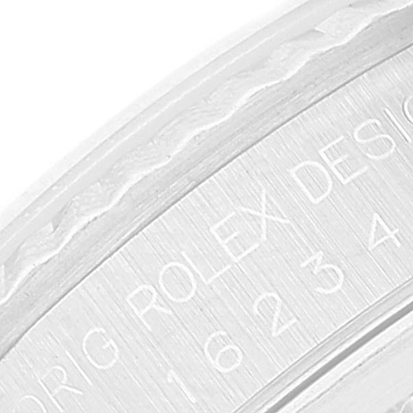 The image shows a close-up of the case back engraving on a Rolex Datejust 16234 Men's Stainless Steel Pink Dial 16234 Men's Stainless Steel Pink Dial watch.