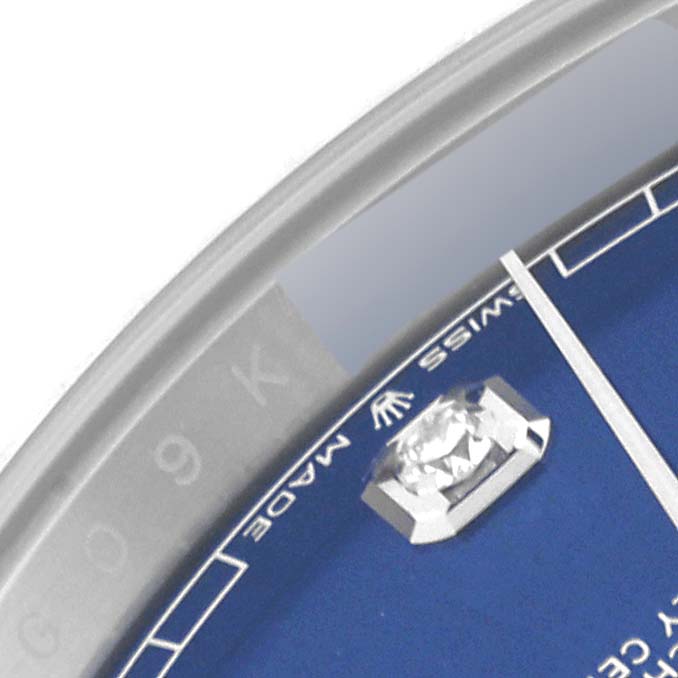 The image shows a close-up of the dial of a Rolex Datejust 41 126334 Men
s Stainless Steel Blue Dial 126334 Men
s Stainless Steel Blue Dial, highlighting the hour marker and part of the bezel.