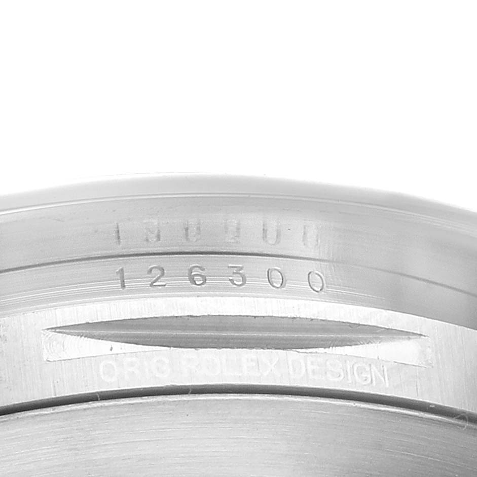 This is a close-up of the inner bezel and reference number 126300 of a Rolex Datejust 41 126300 Men's Stainless Steel White Dial 126300 Men's Stainless Steel White Dial watch.