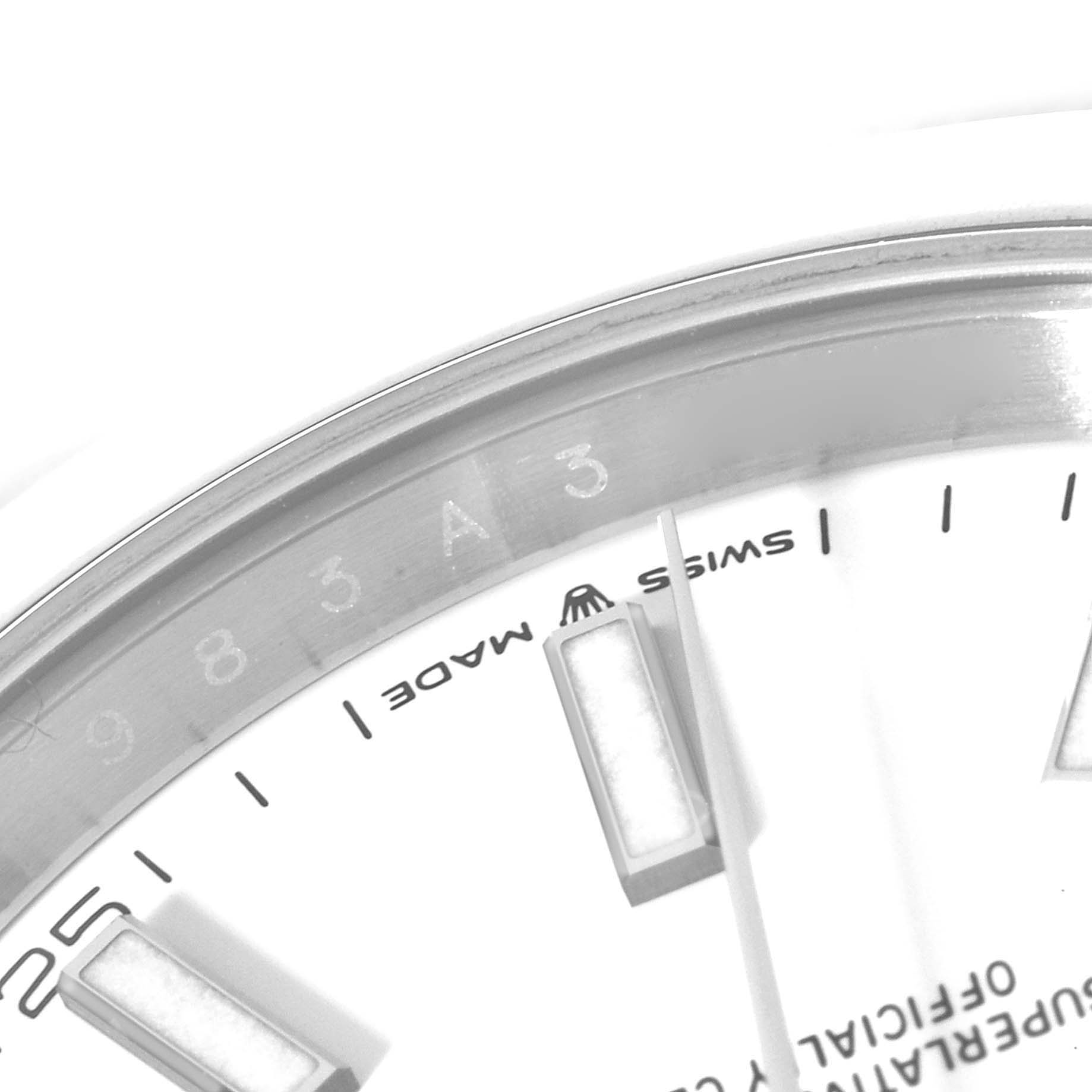 The image shows a close-up of the dial and part of the bezel of a Rolex Datejust 41 126300 Men's Stainless Steel White Dial 126300 Men's Stainless Steel White Dial watch, highlighting the hour markers and text.