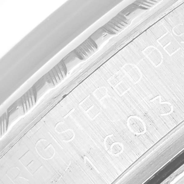 This close-up shows the etched serial and model number on the case side of a Rolex Vintage Collection 1603 Men's Stainless Steel Blue Dial 1603 Men's Stainless Steel Blue Dial watch.