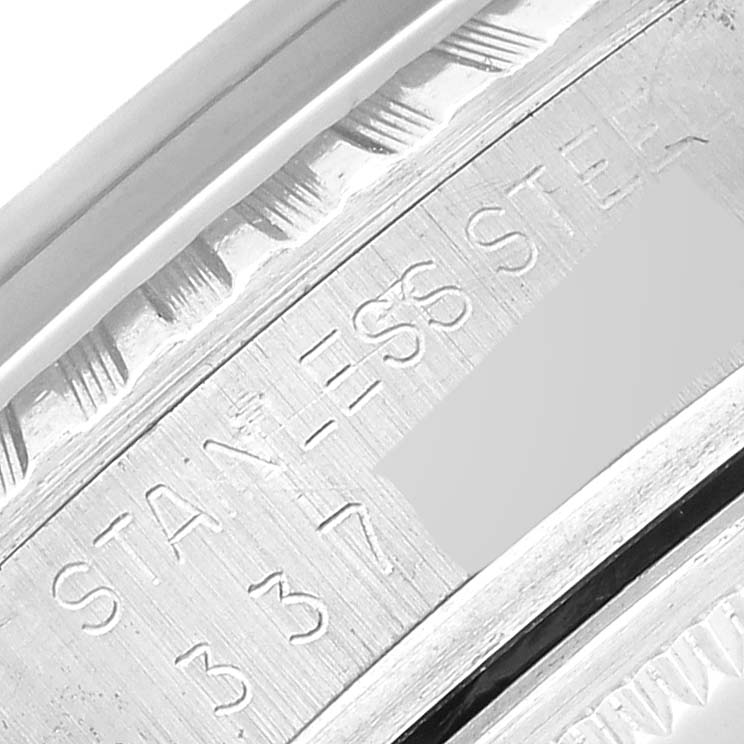 This close-up image shows the engraved "STAINLESS STEEL" text on the bezel of the Vintage Collection Rolex model.