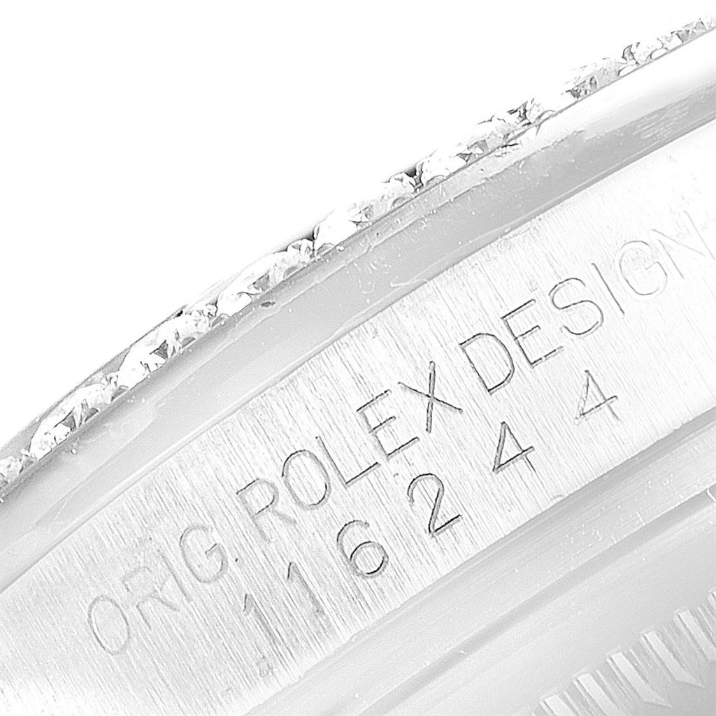 This close-up image shows the engraved side of the bezel and the serial number on a Rolex Datejust 116244 Men's Stainless Steel Silver Dial 116244 Men's Stainless Steel Silver Dial watch.