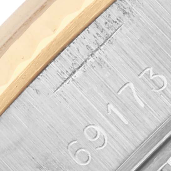 The image shows the case with model number engraving of a Rolex Datejust 69173 Women's Steel and Gold (two tone) Champagne Dial 69173 Women's Steel and Gold (two tone) Champagne Dial watch, highlighting its metallic finish.