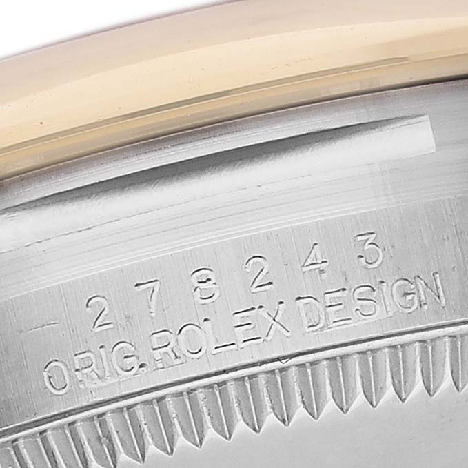 The image shows a close-up of the side of a Mid-Size Rolex watch, focusing on the model number and "ORIG. ROLEX DESIGN" engraving.